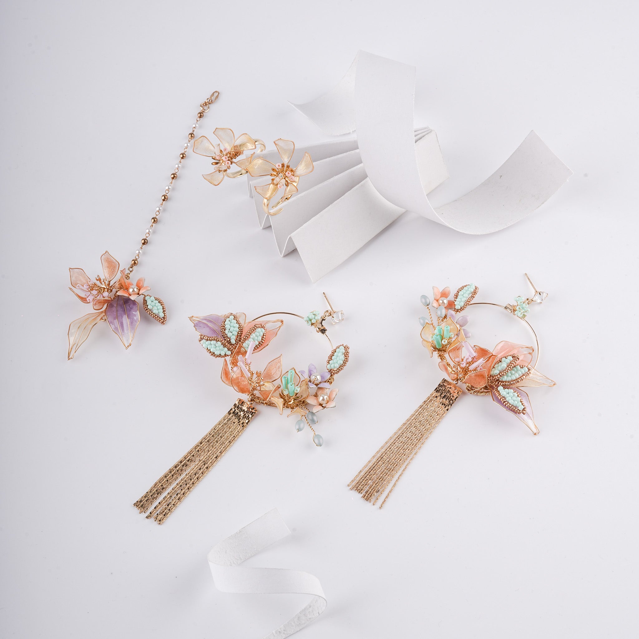 The Pastel Mirage Floral Resin Art Jewelry Set with Tassel Earrings
