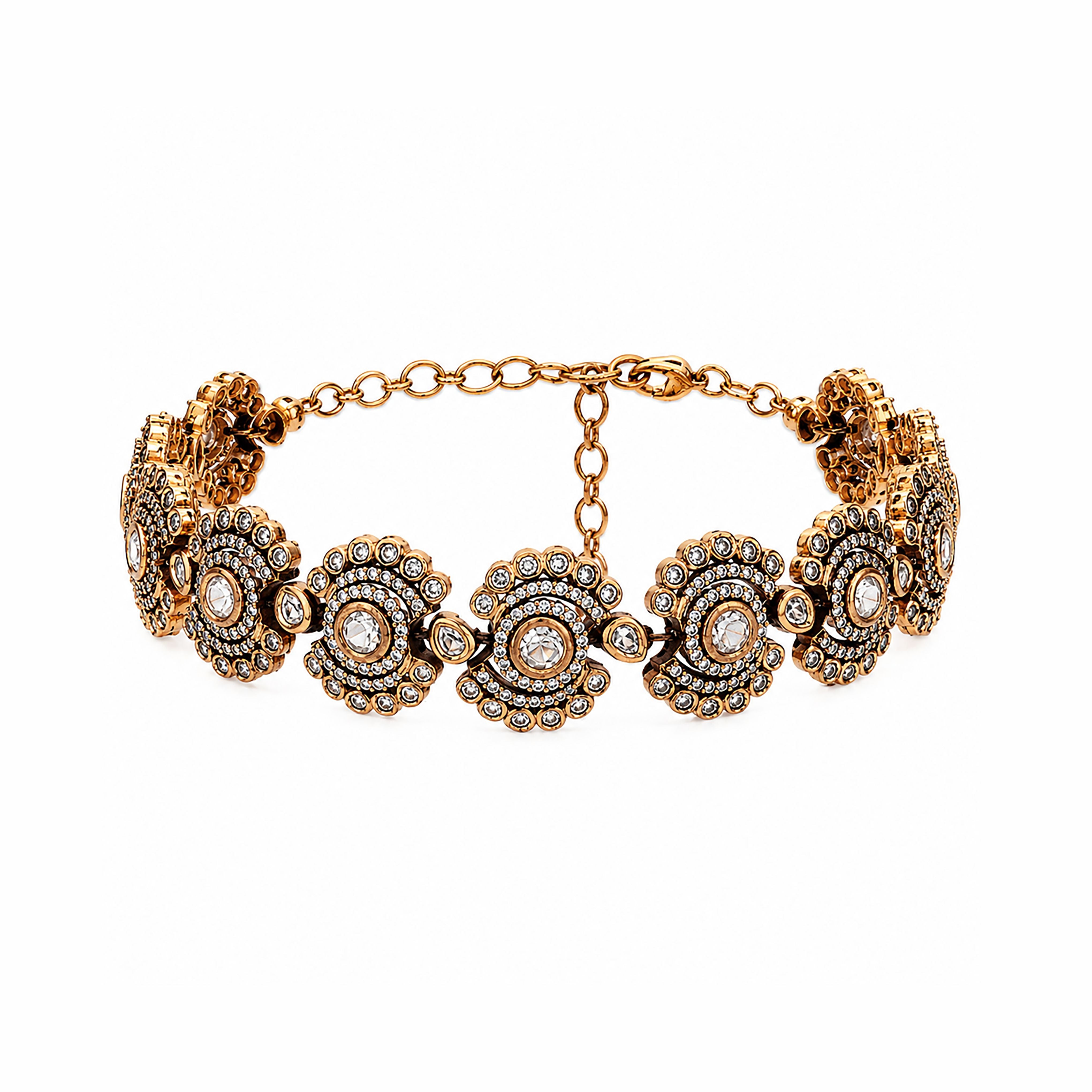 Antique gold plated link bracelet featuring scalloped floral medallions, pavé stone borders, and lobster clasp closure.