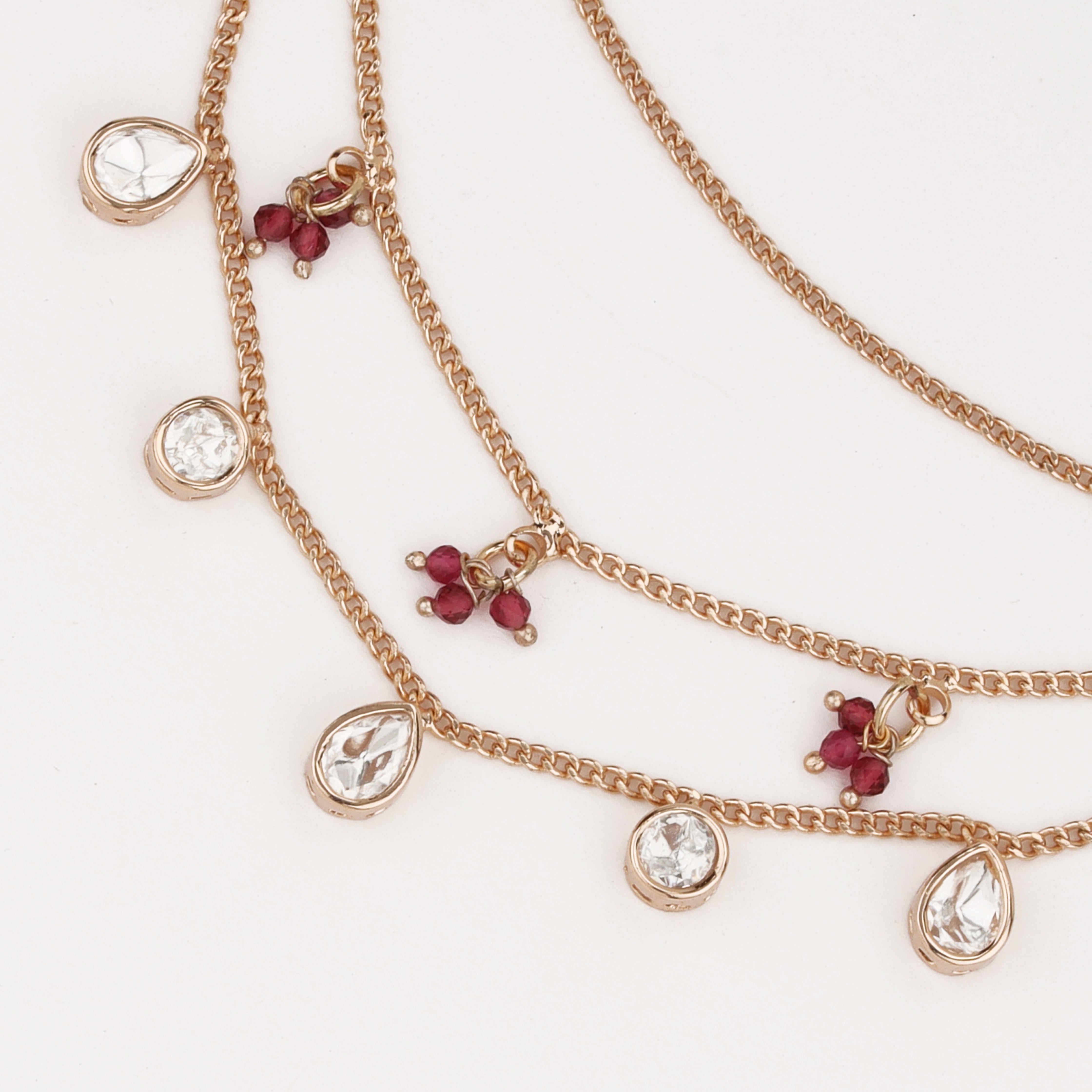 Ruby Charm Crystal Ear Chain with crystal drops and ruby bead accents by US Catalog