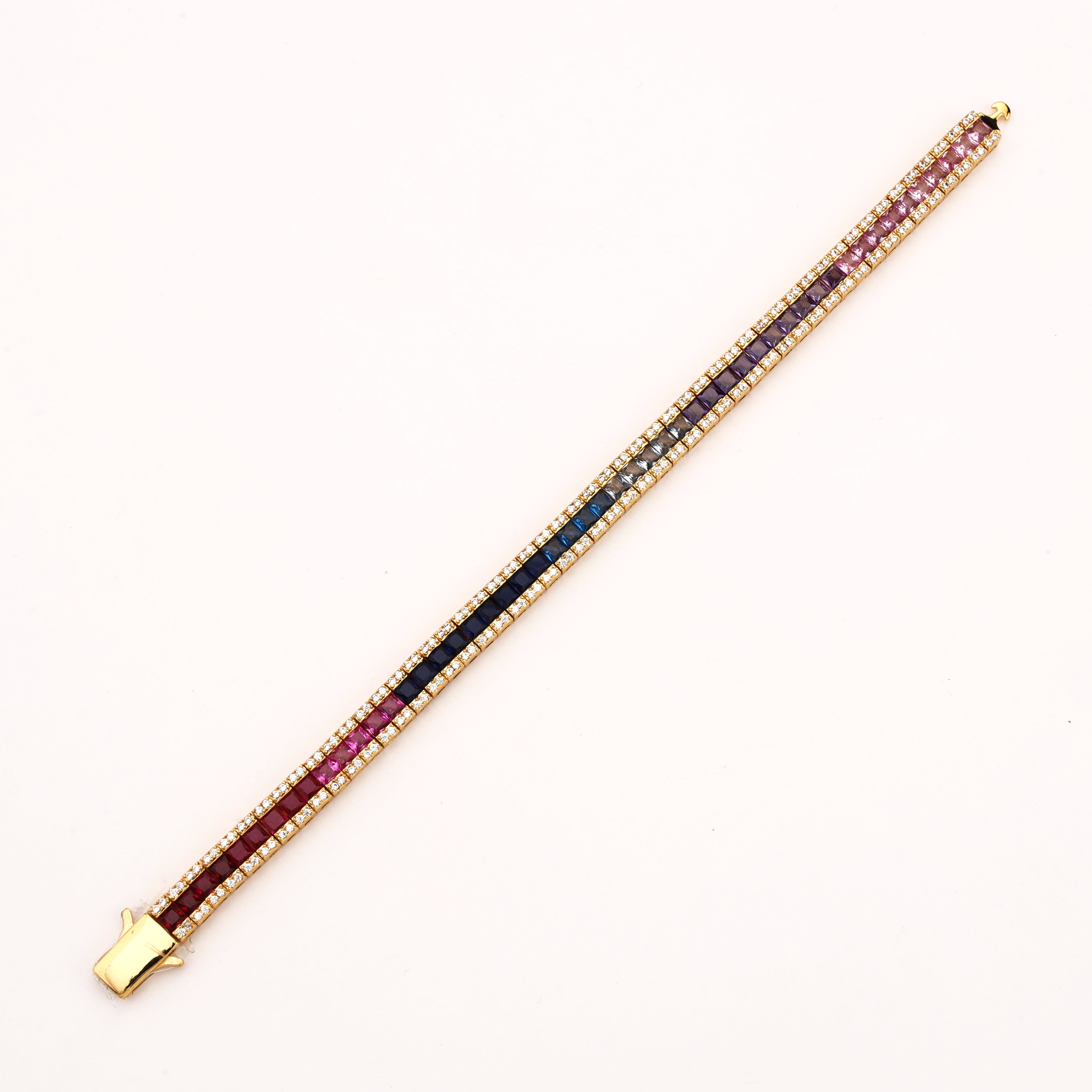 Rainbow gold-tone ombre crystal bracelet with purple, clear, aqua and deep blue square stones