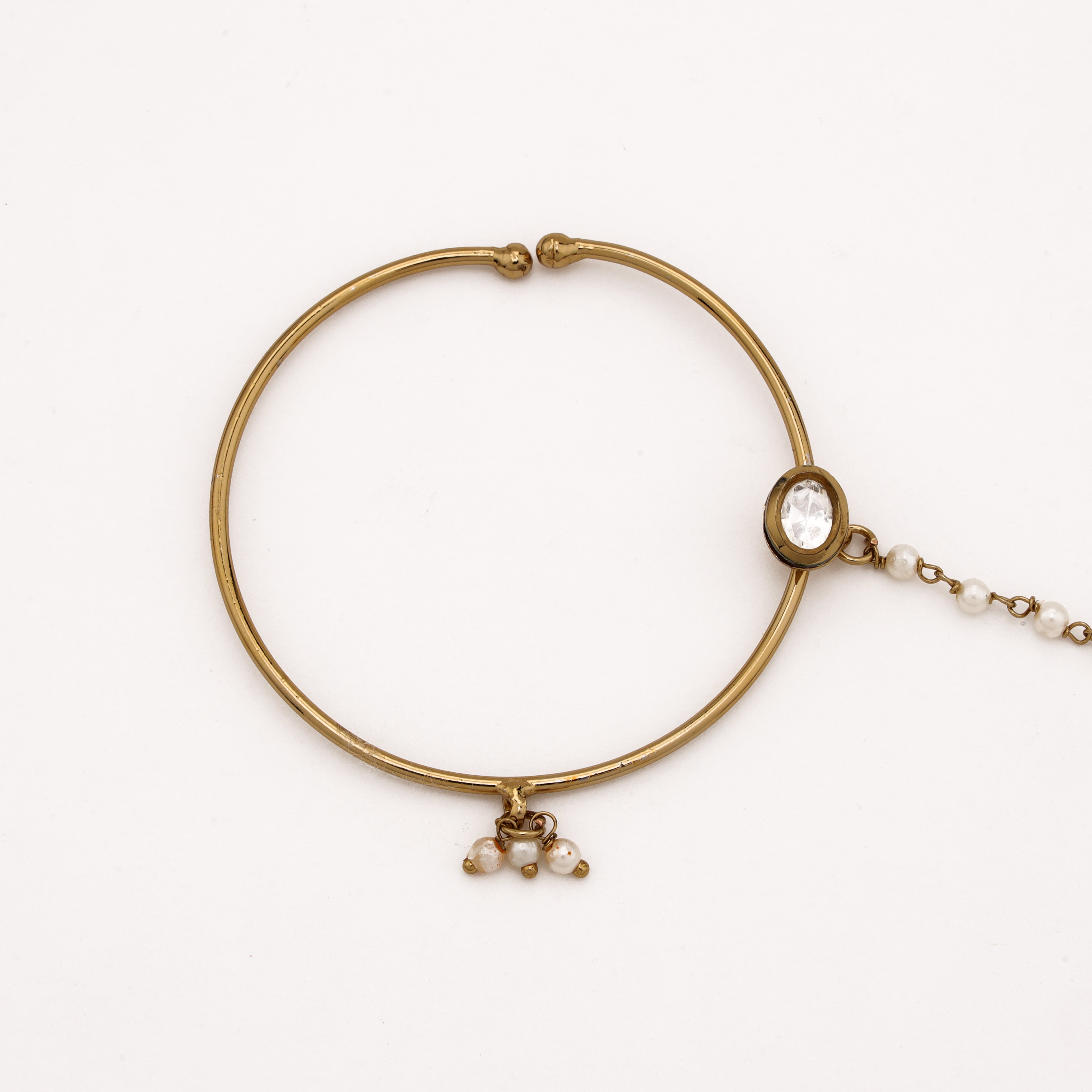 Antique gold Avira oval polki pearl nath with large hoop, white stone, pearl drop and attached beaded chain from US Catalog