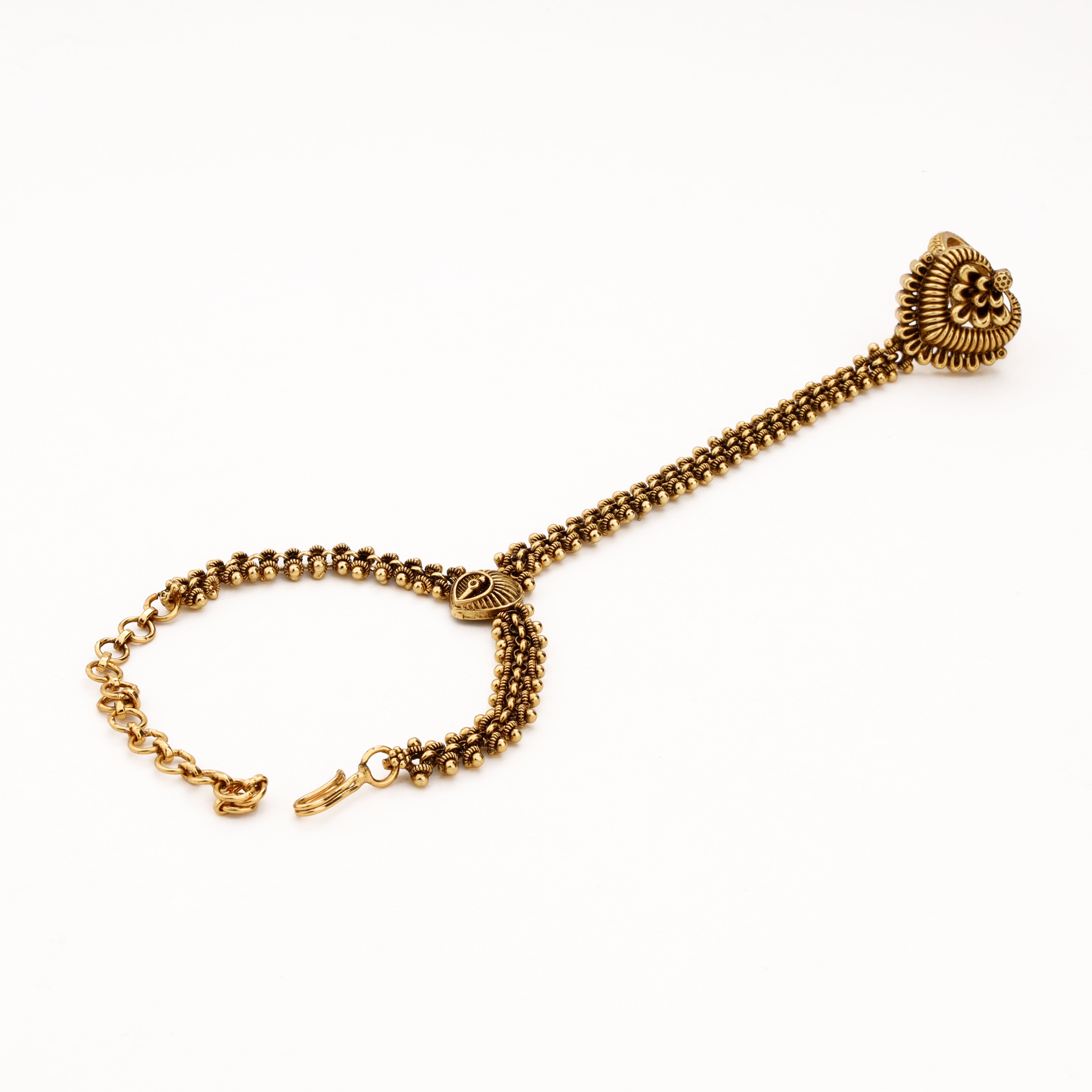 Antique gold paisley pocha with layered beaded chains, statement finger ring and adjustable wrist closure