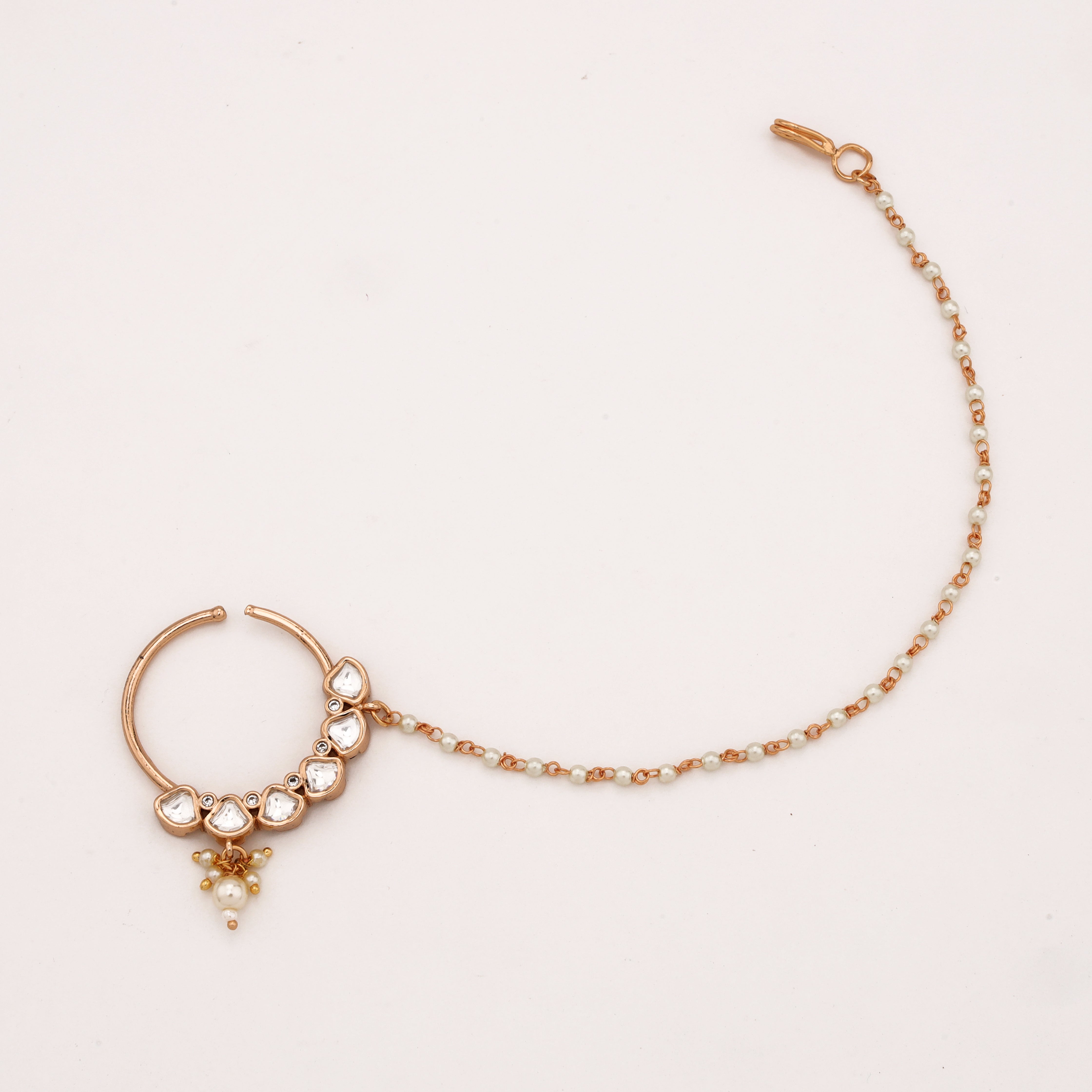 Rose gold Crescent Polki Pearl Nath with geometric white stones, pearl drop and attached beaded chain from US Catalog