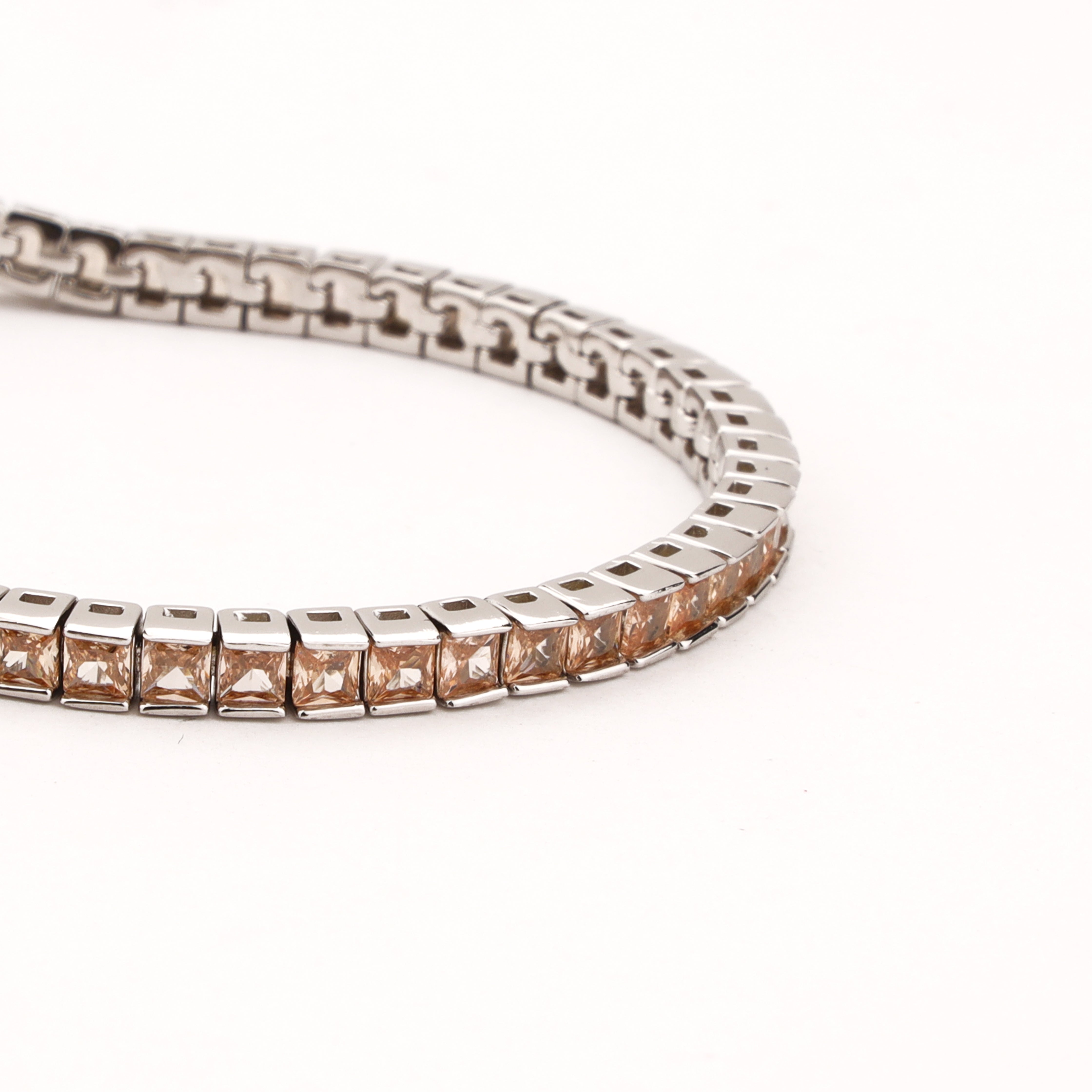 Serenna silver-tone tennis bracelet with champagne square-cut crystal stones in sleek linked settings