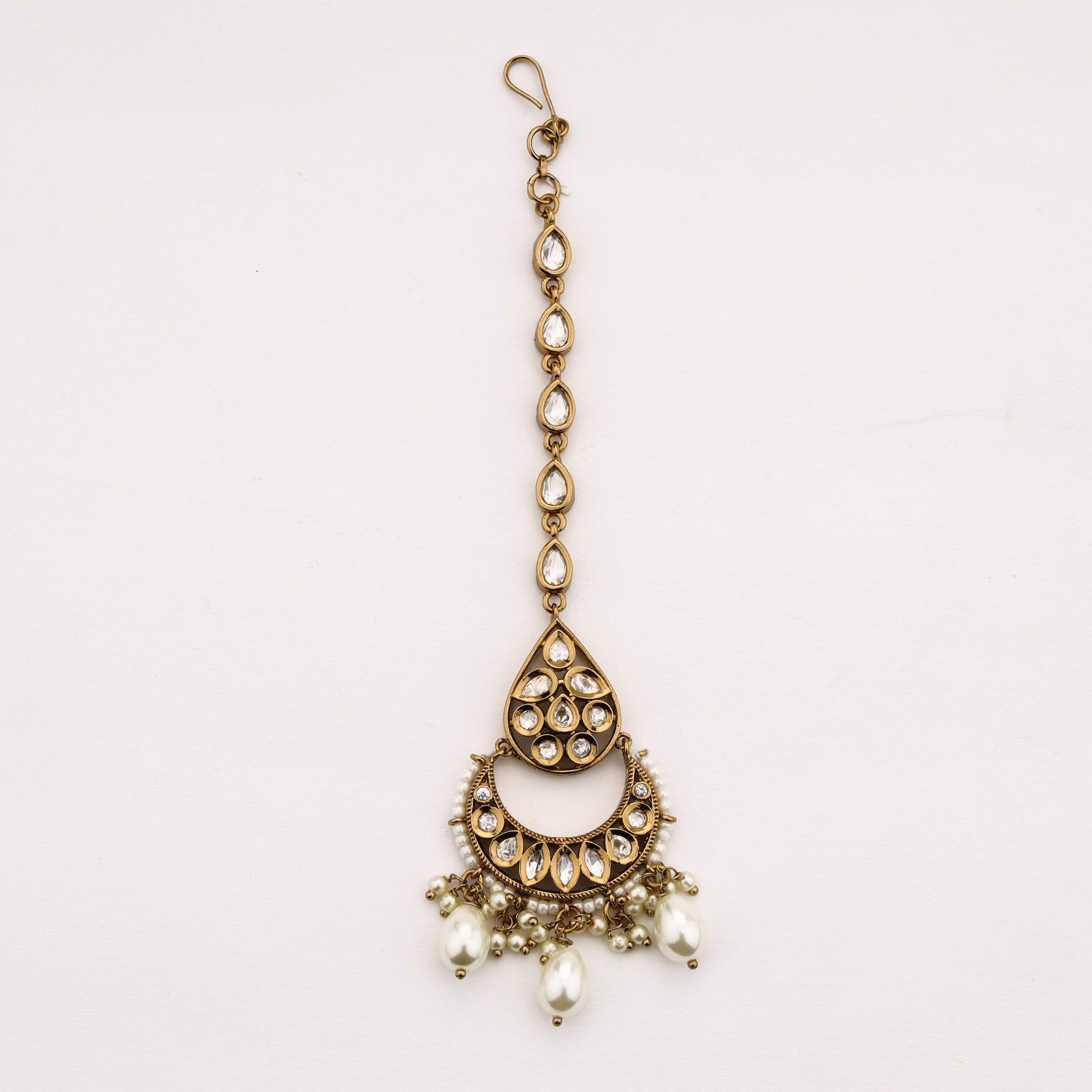 Diamond pearl crescent Maang Tika in antique gold finish by US Catalog