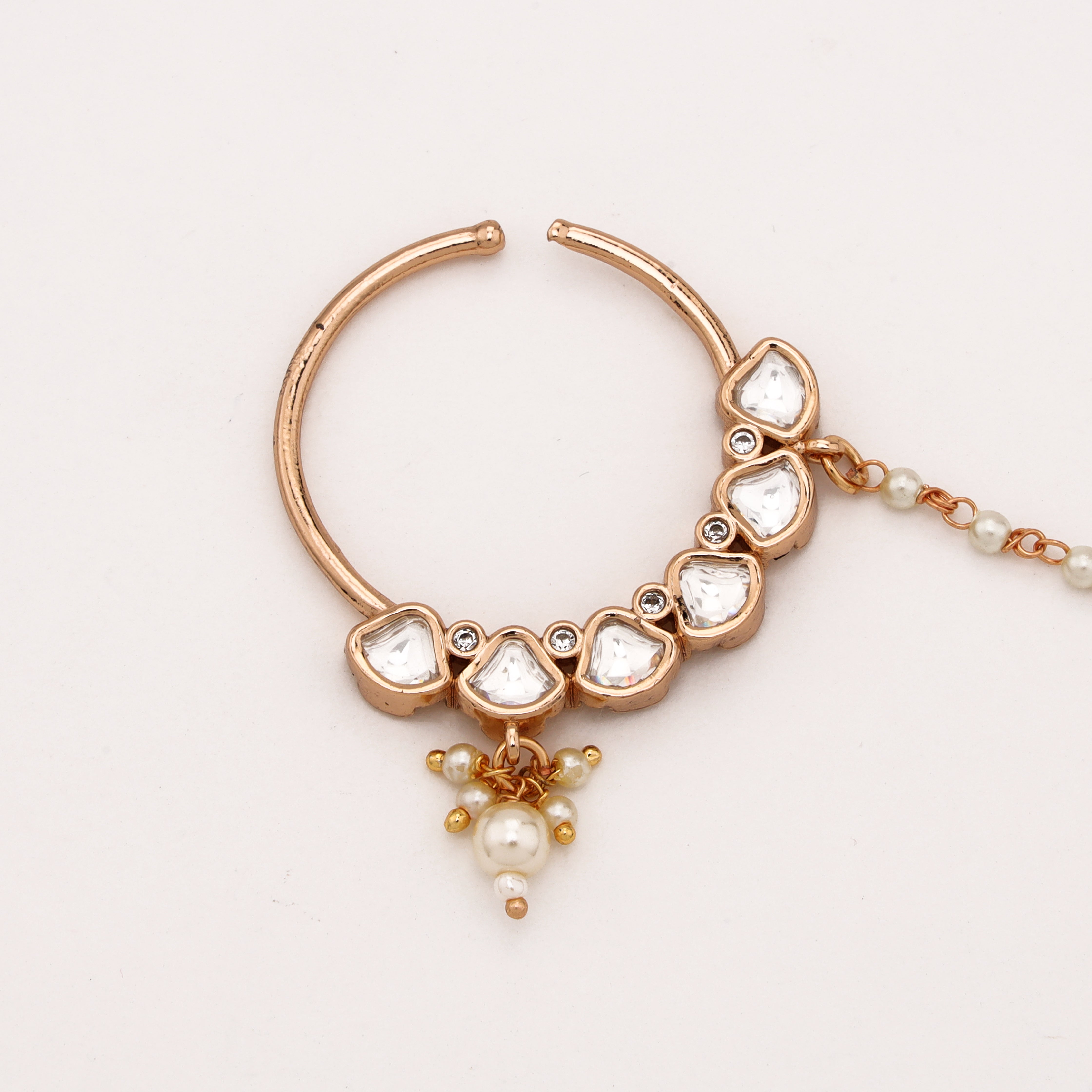 Rose gold Crescent Polki Pearl Nath with geometric white stones, pearl drop and attached beaded chain from US Catalog
