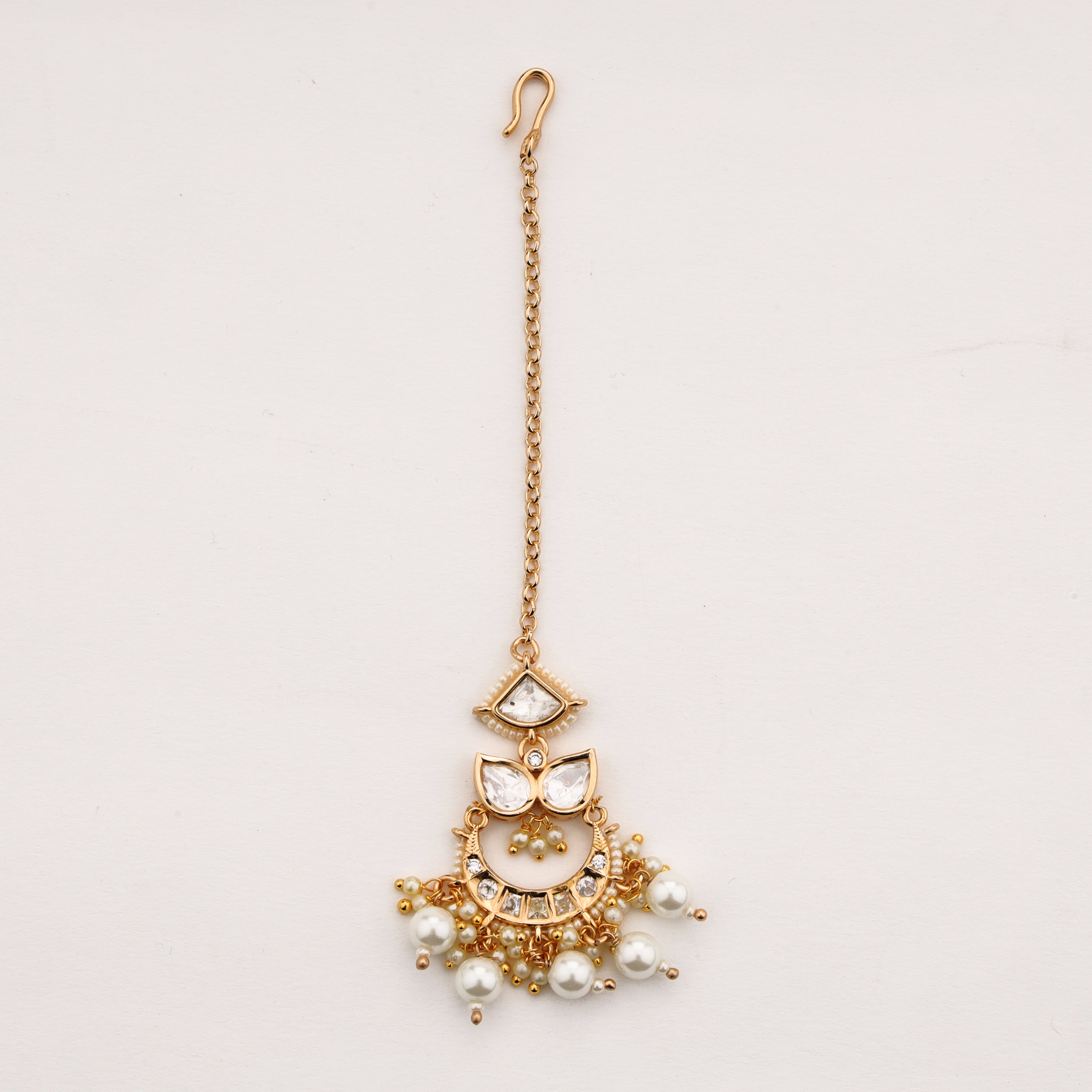 Diamond pearl charm Maang Tika with gold finish and pearl tassels by US Catalog