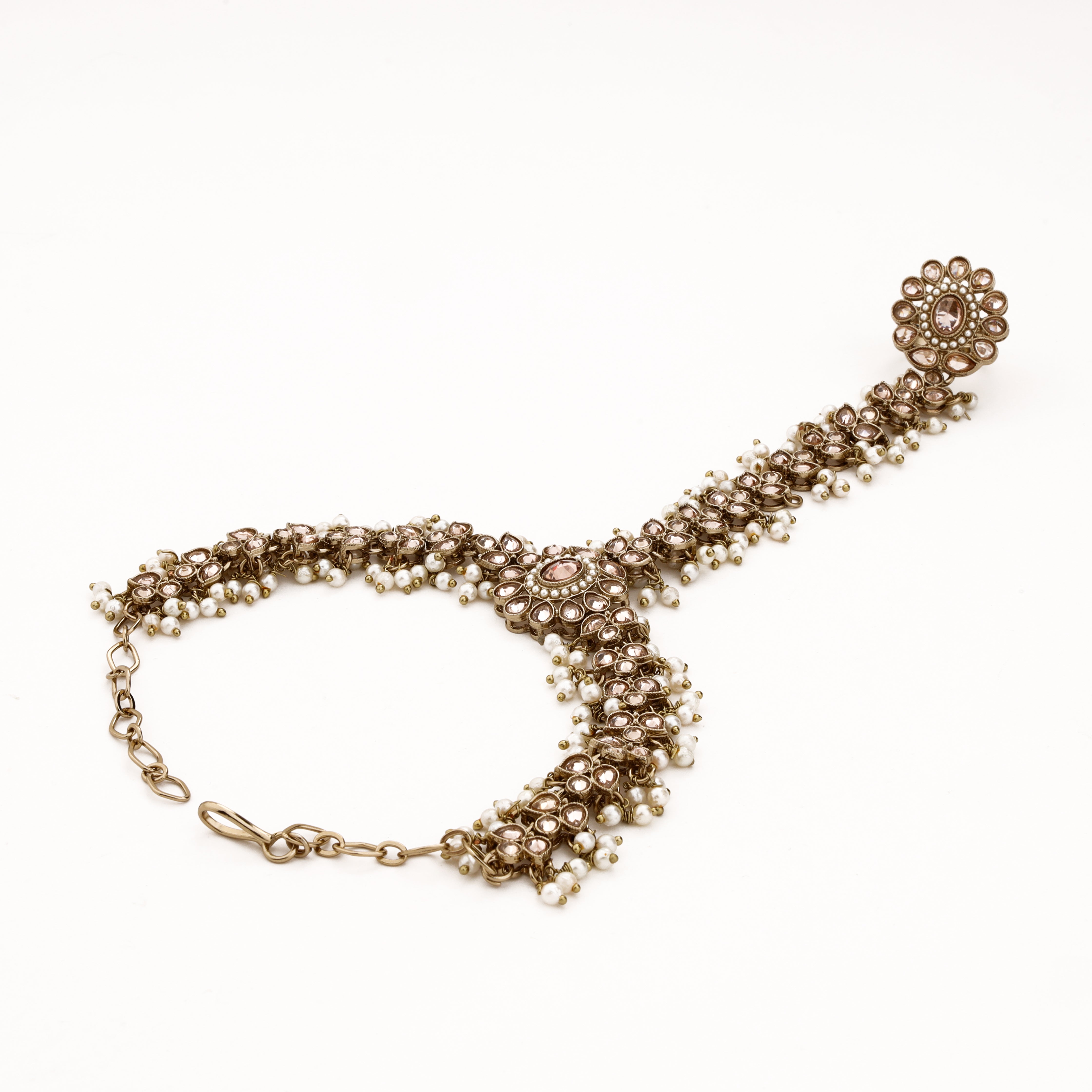 Alternate view of antique gold bridal pocha with champagne teardrop stones, white pearl fringes and statement finger ring