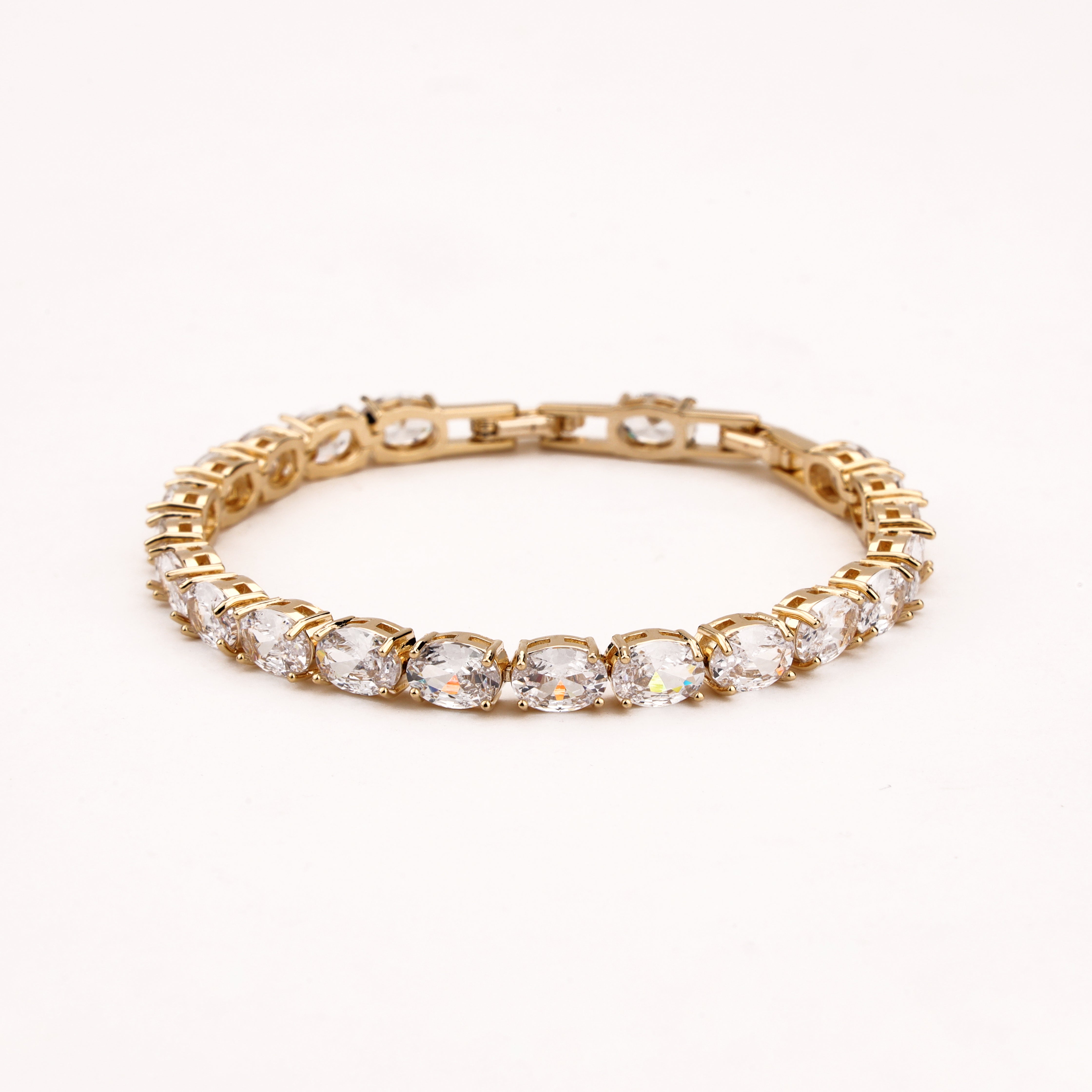 Marielle gold-tone tennis bracelet with a continuous row of oval-cut clear crystal stones