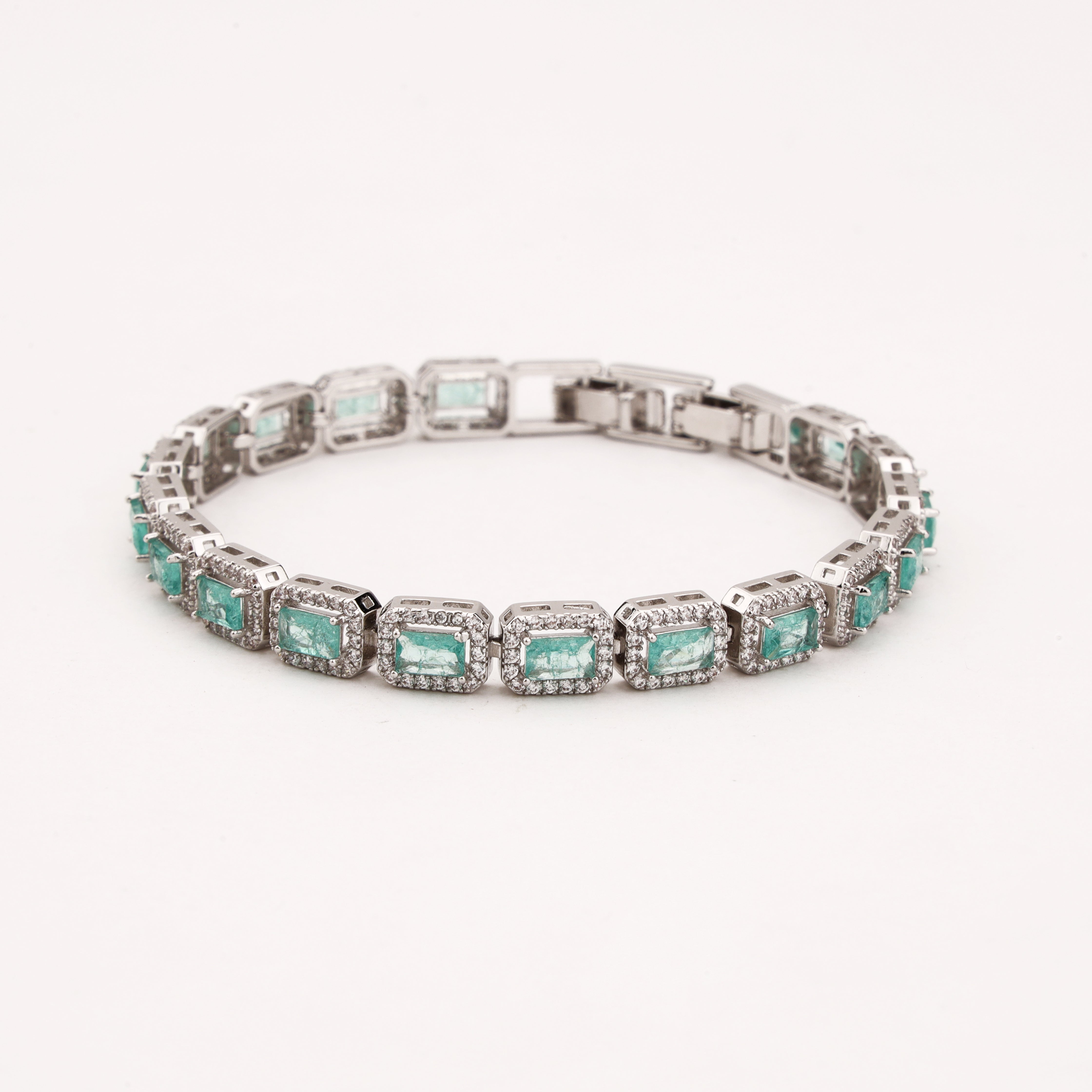 Maristelle silver-tone bracelet with rectangular aqua crystal stones surrounded by sparkling clear crystal halos
