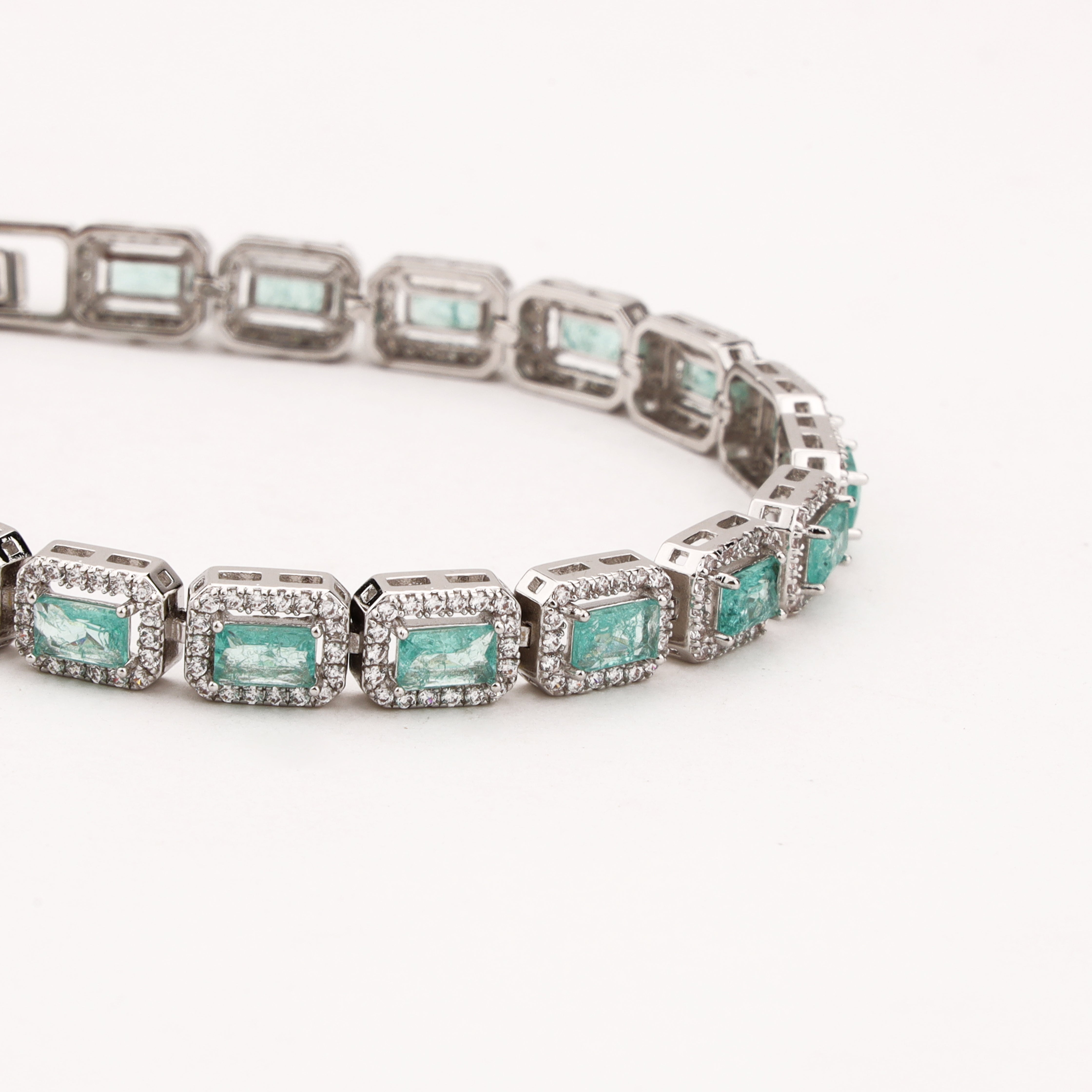 Maristelle silver-tone bracelet with rectangular aqua crystal stones surrounded by sparkling clear crystal halos