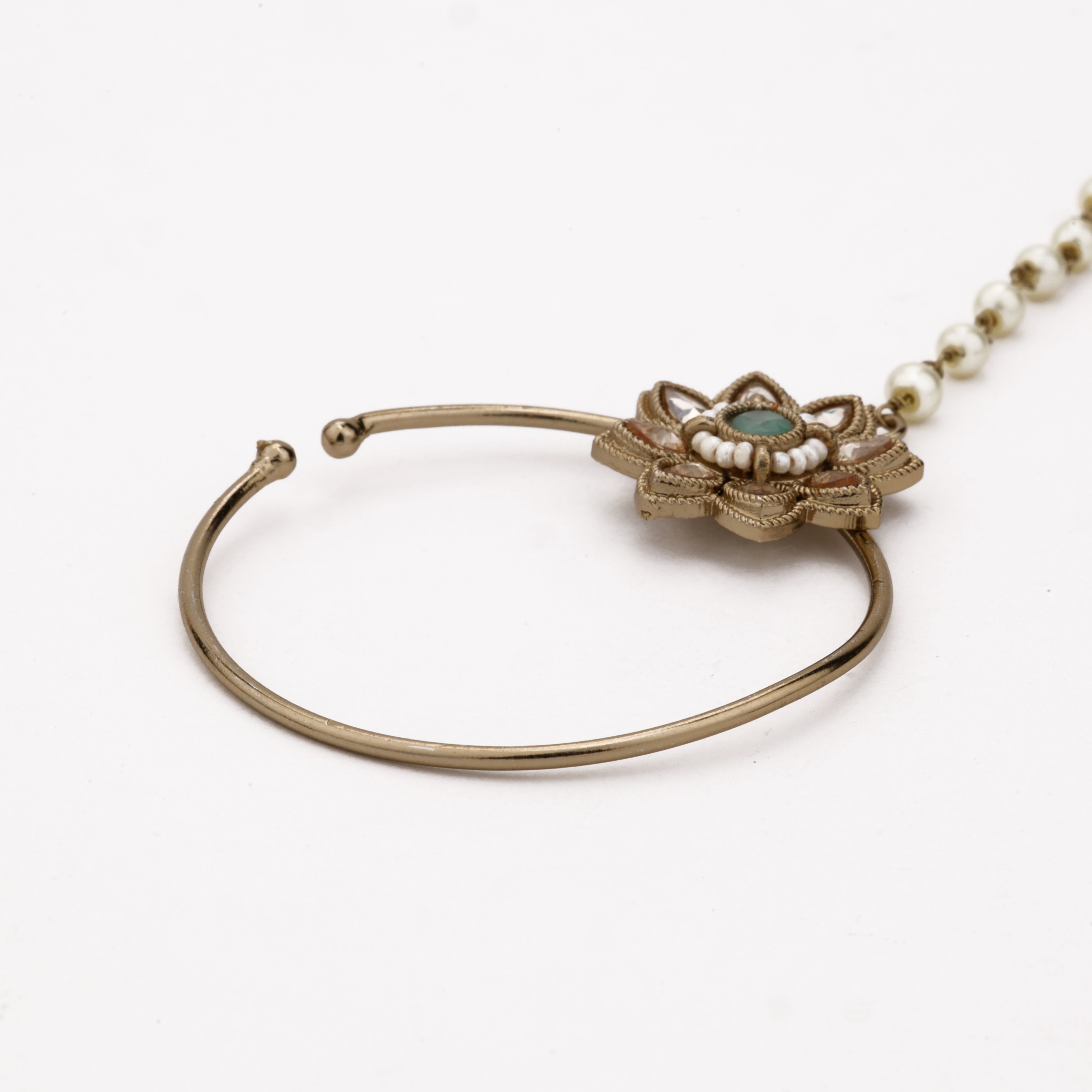 Antique gold Nayeli emerald lotus polki nath with green centre stone, teardrop accents and pearl-beaded chain from US Catalog