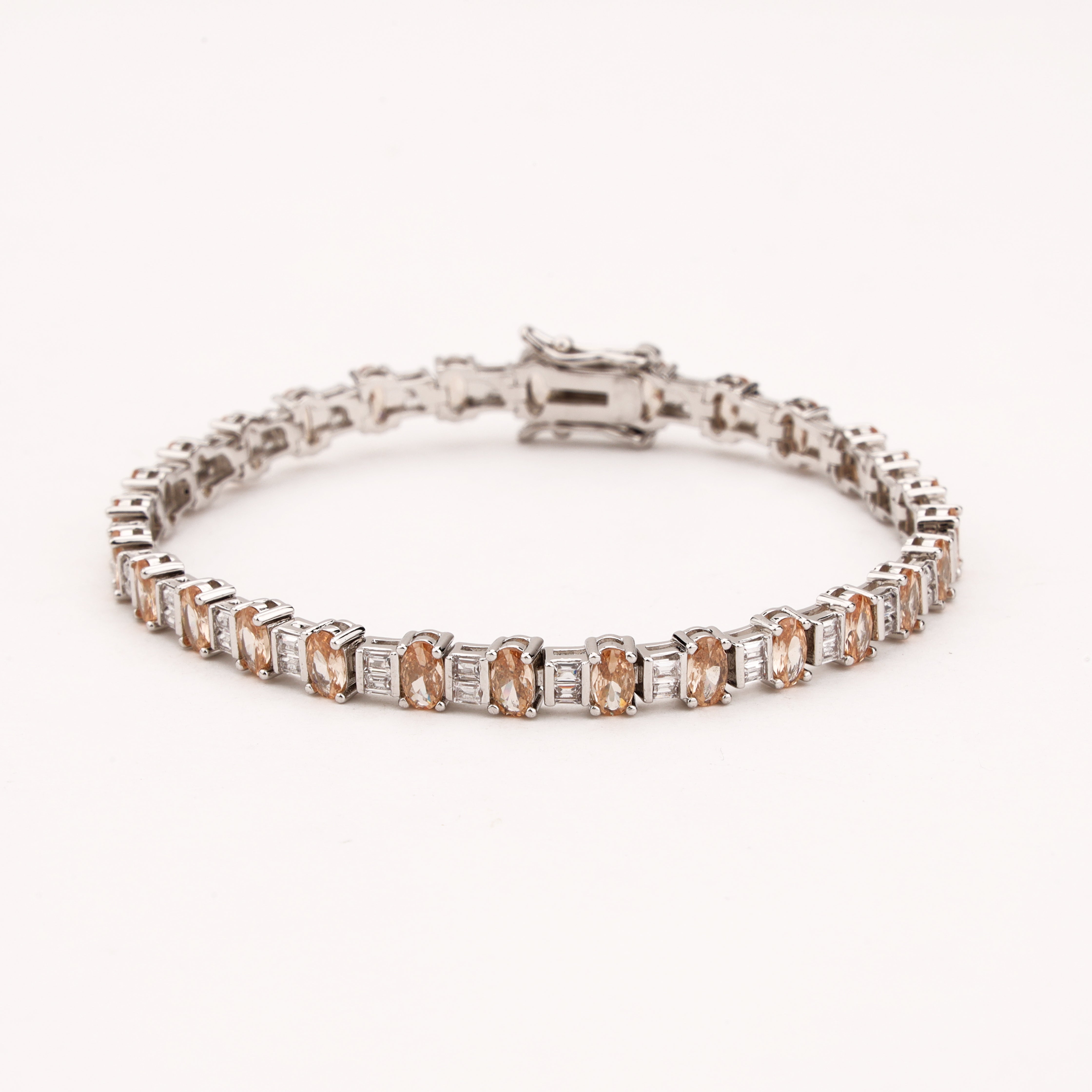 Elaris silver-tone bracelet with champagne oval crystals and clear baguette-style crystal accents