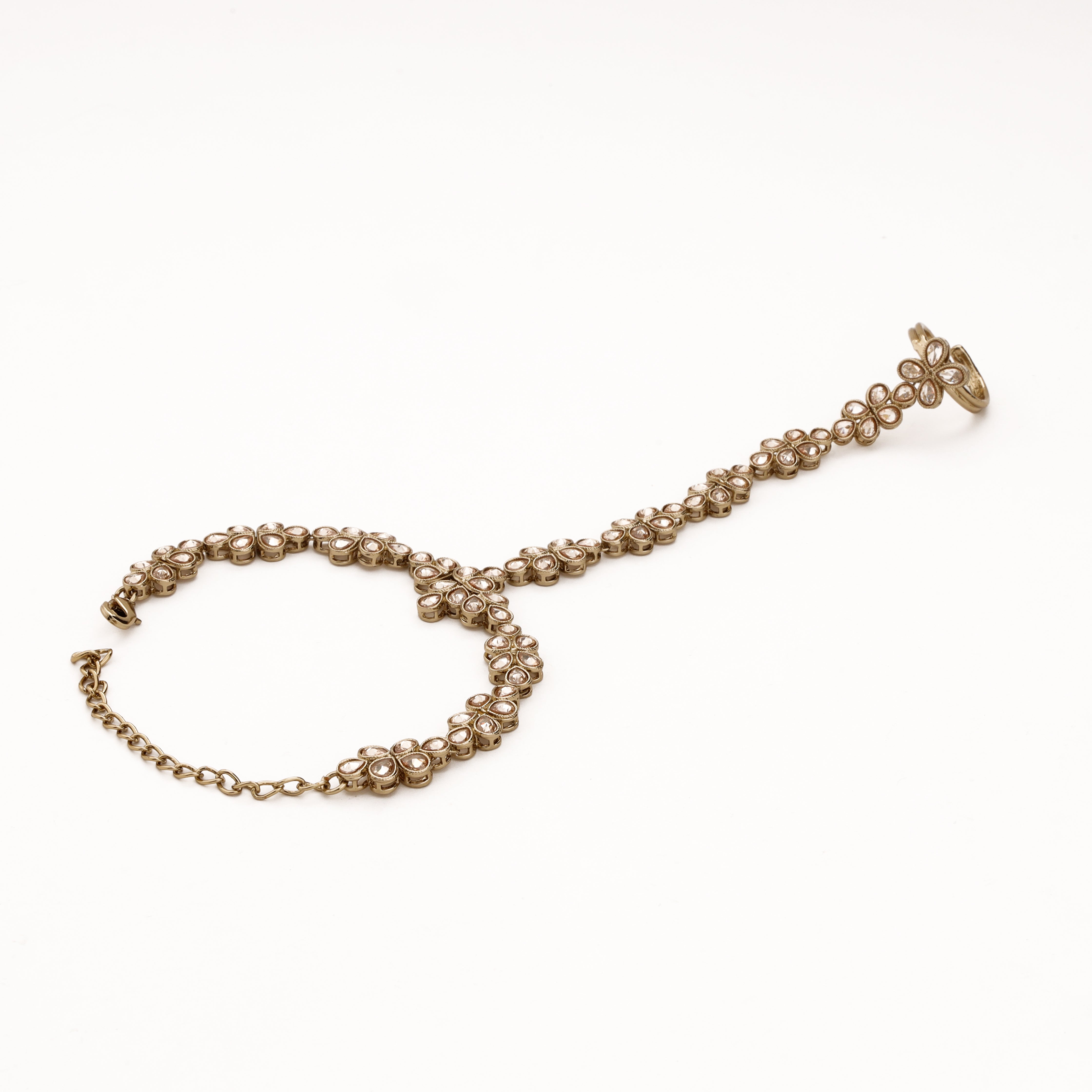 Antique silver teardrop vine pocha with clear kundan-style stones, adjustable finger ring and wrist chain