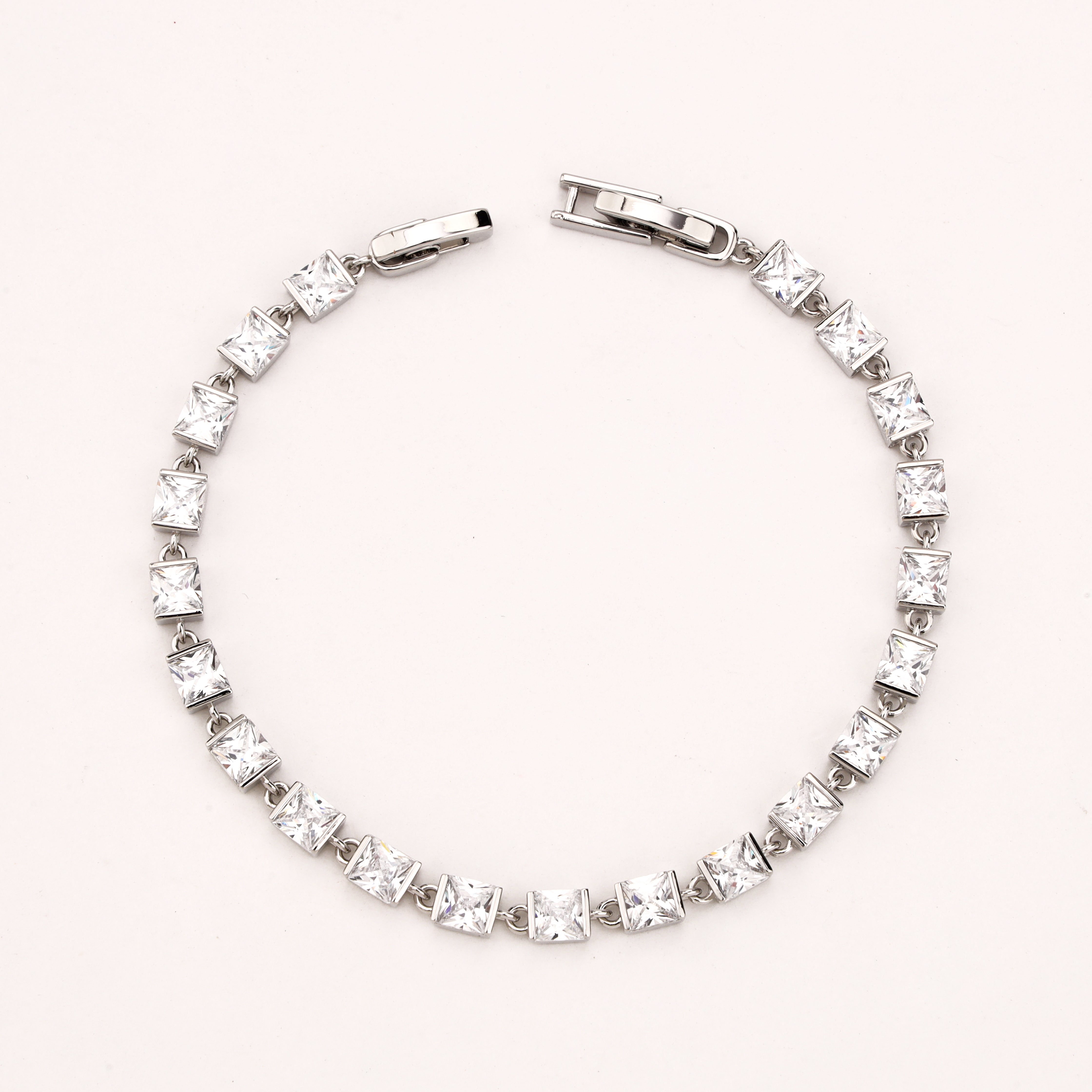 Evelisse silver-tone link bracelet with clear square-cut crystal stones in geometric settings