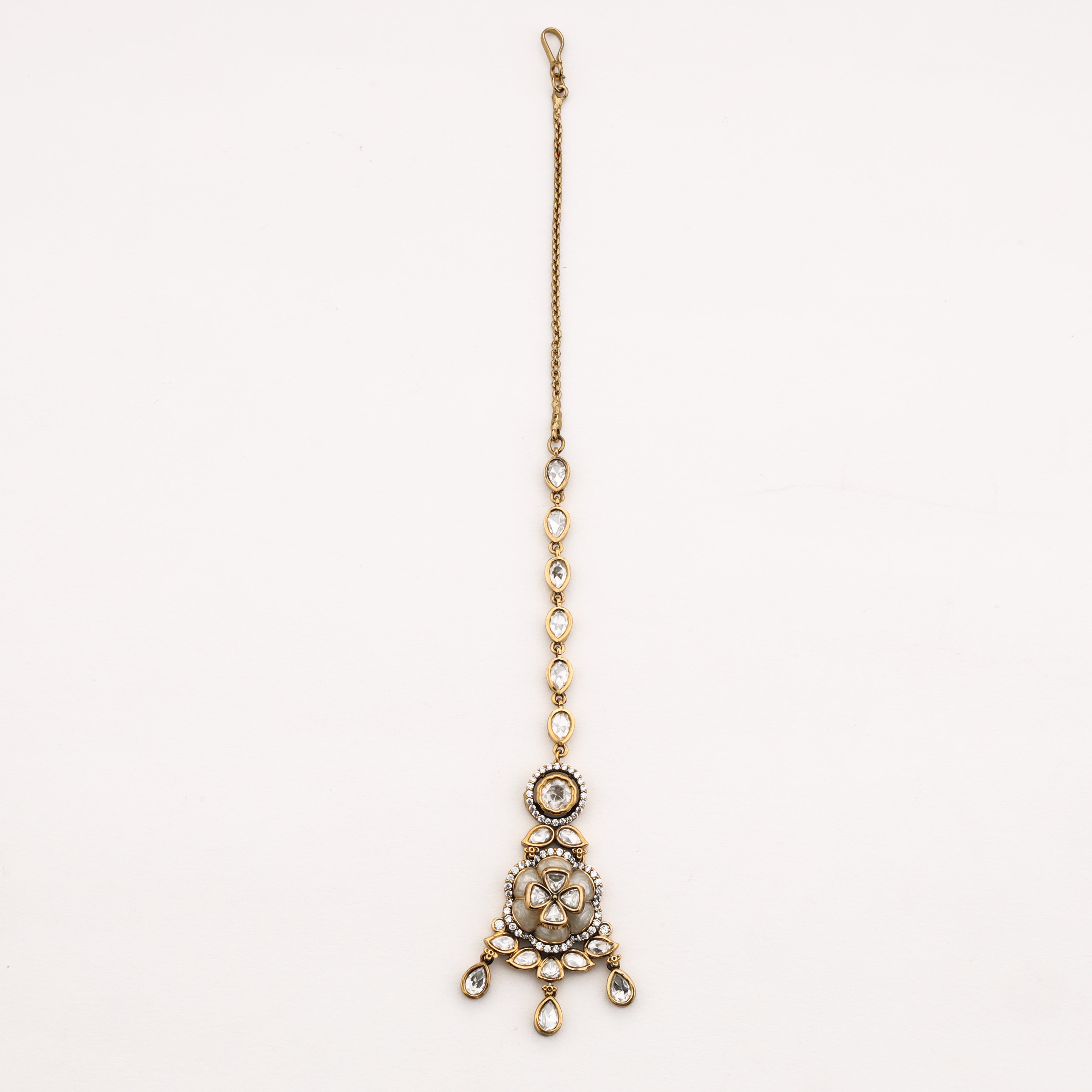 Floral crystal Maang Tika with pear-cut crystal accents and gold finish by US Catalog