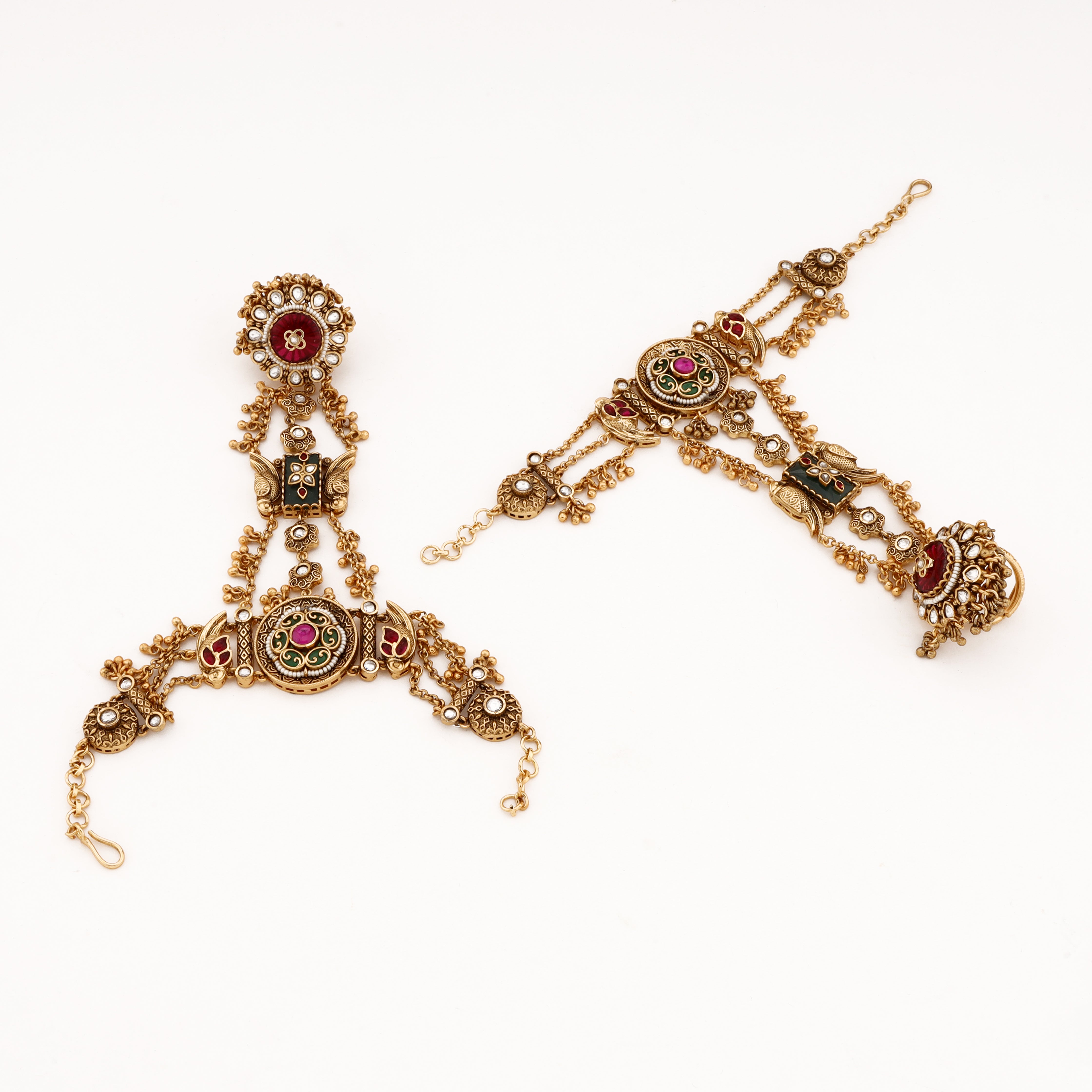 Antique gold multicolor kundan pearl pocha with pink and green stones, layered chains and statement finger ring