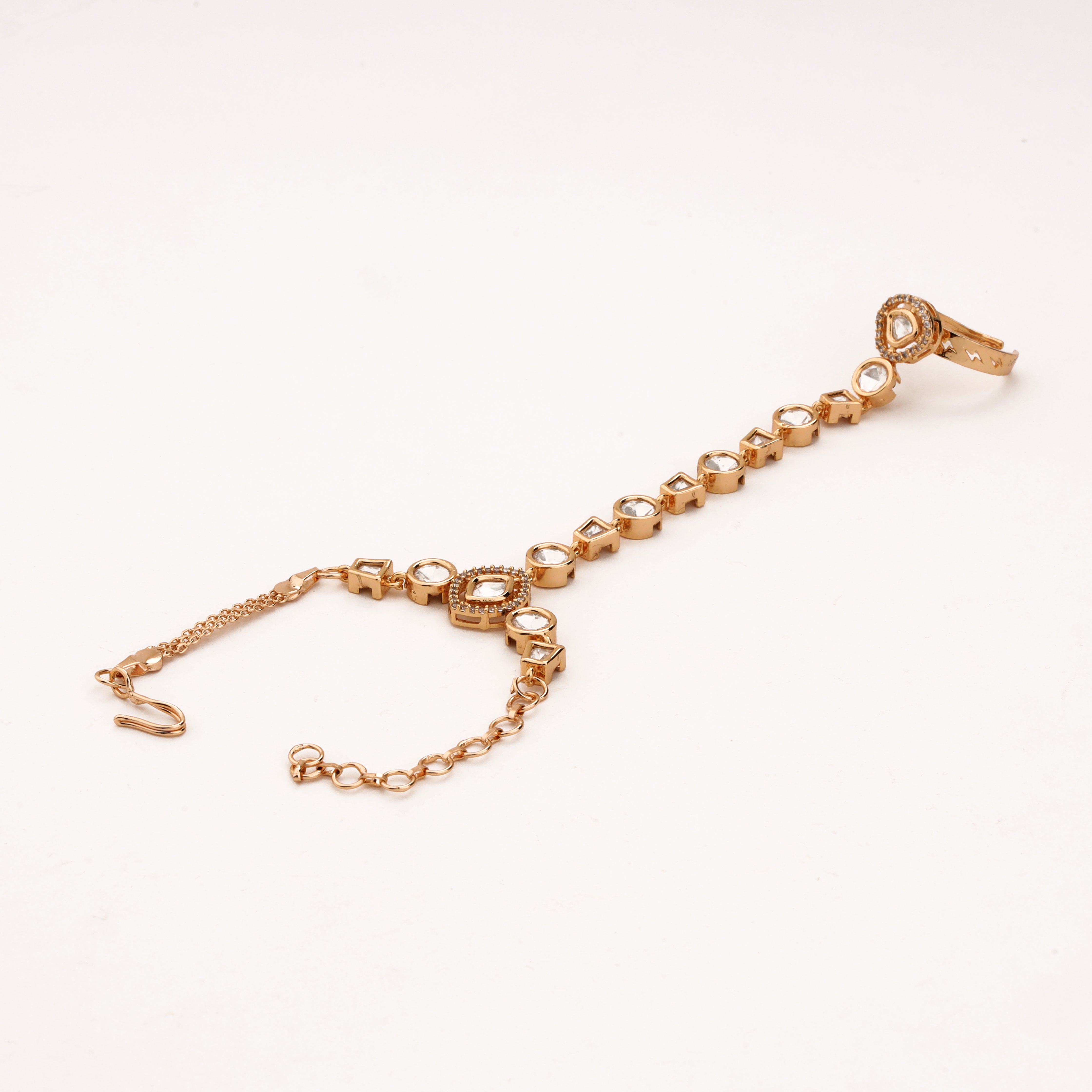 Rose gold geometric kundan pocha pair with round and square white stones, adjustable rings and wrist chains
