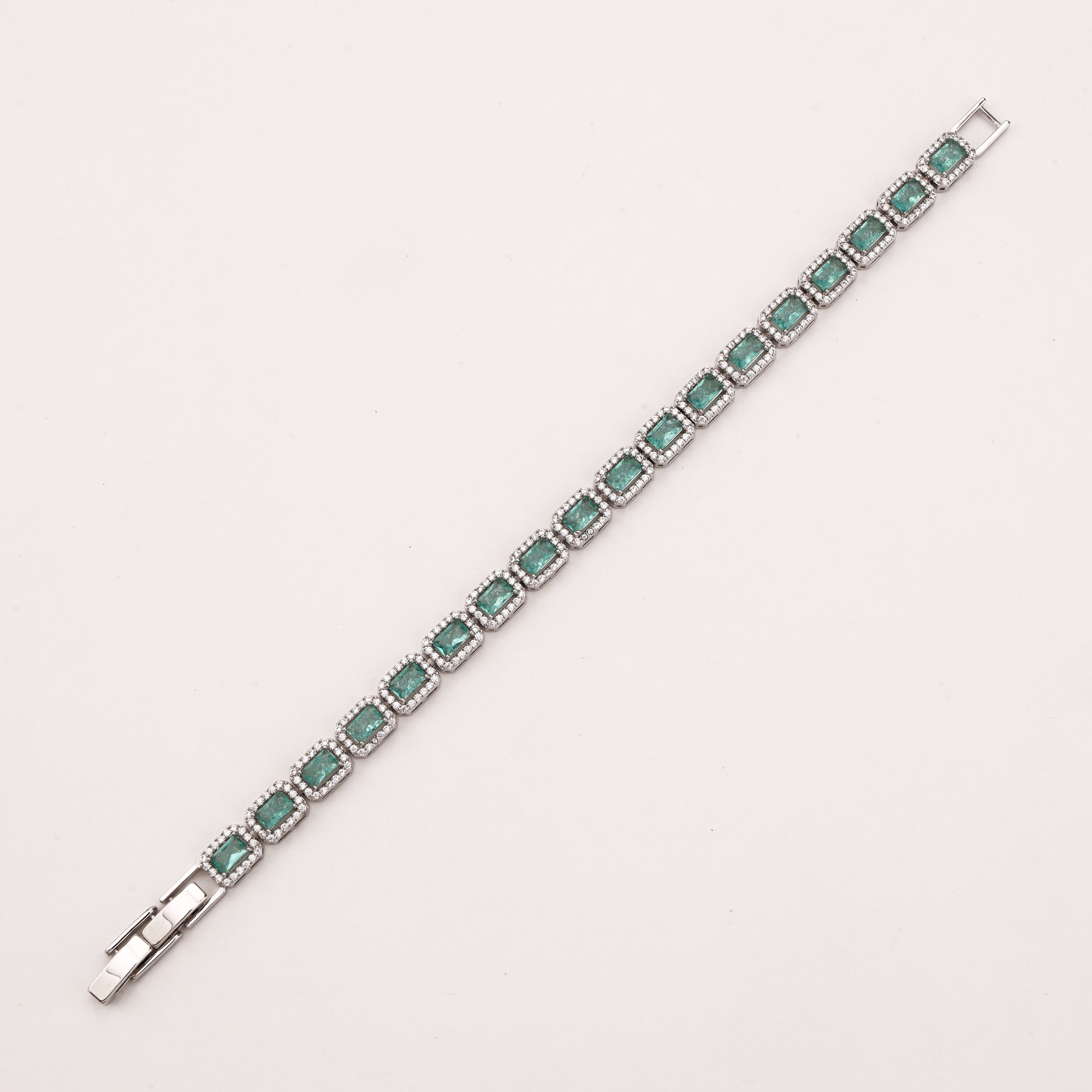Maristelle silver-tone bracelet with rectangular aqua crystal stones surrounded by sparkling clear crystal halos
