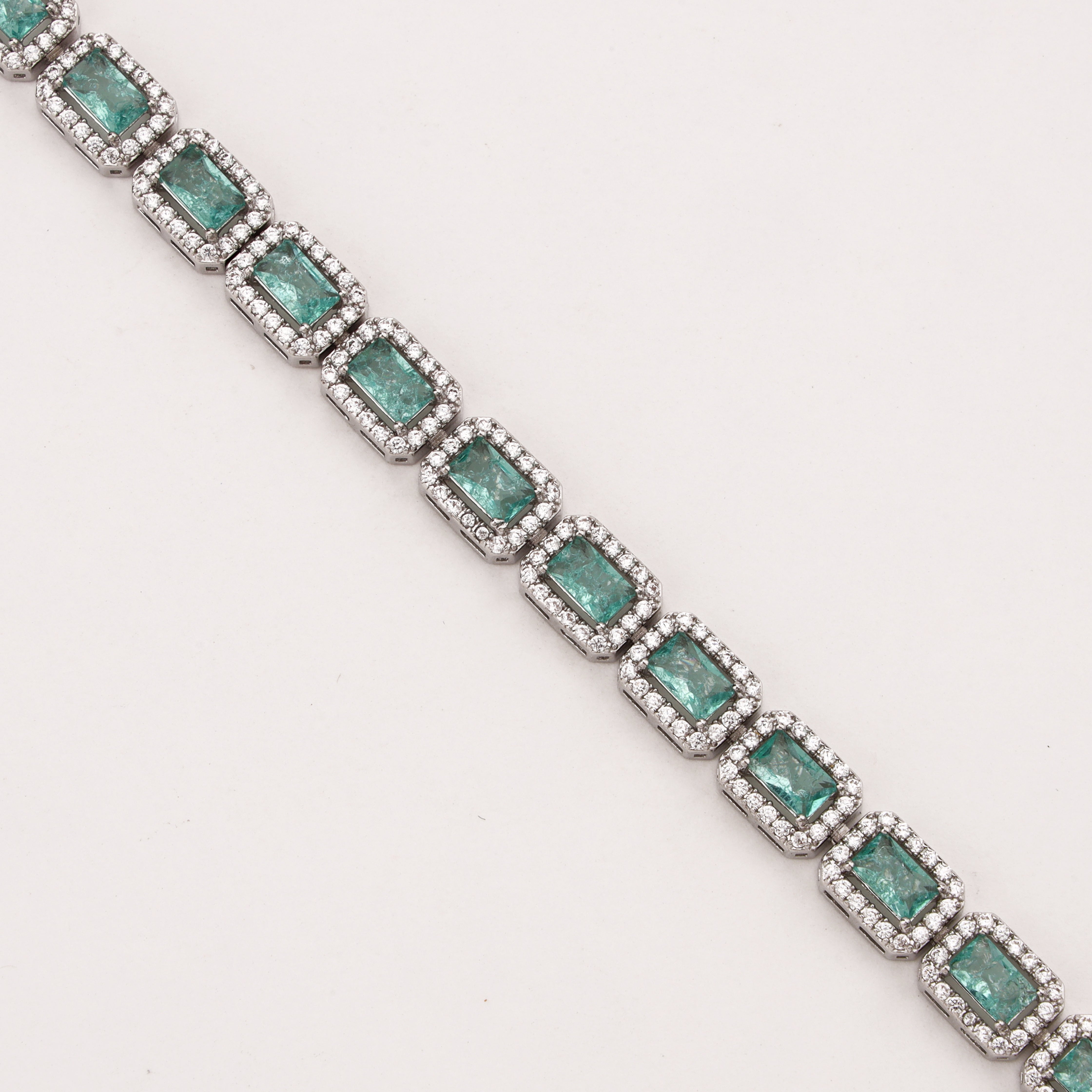 Maristelle silver-tone bracelet with rectangular aqua crystal stones surrounded by sparkling clear crystal halos