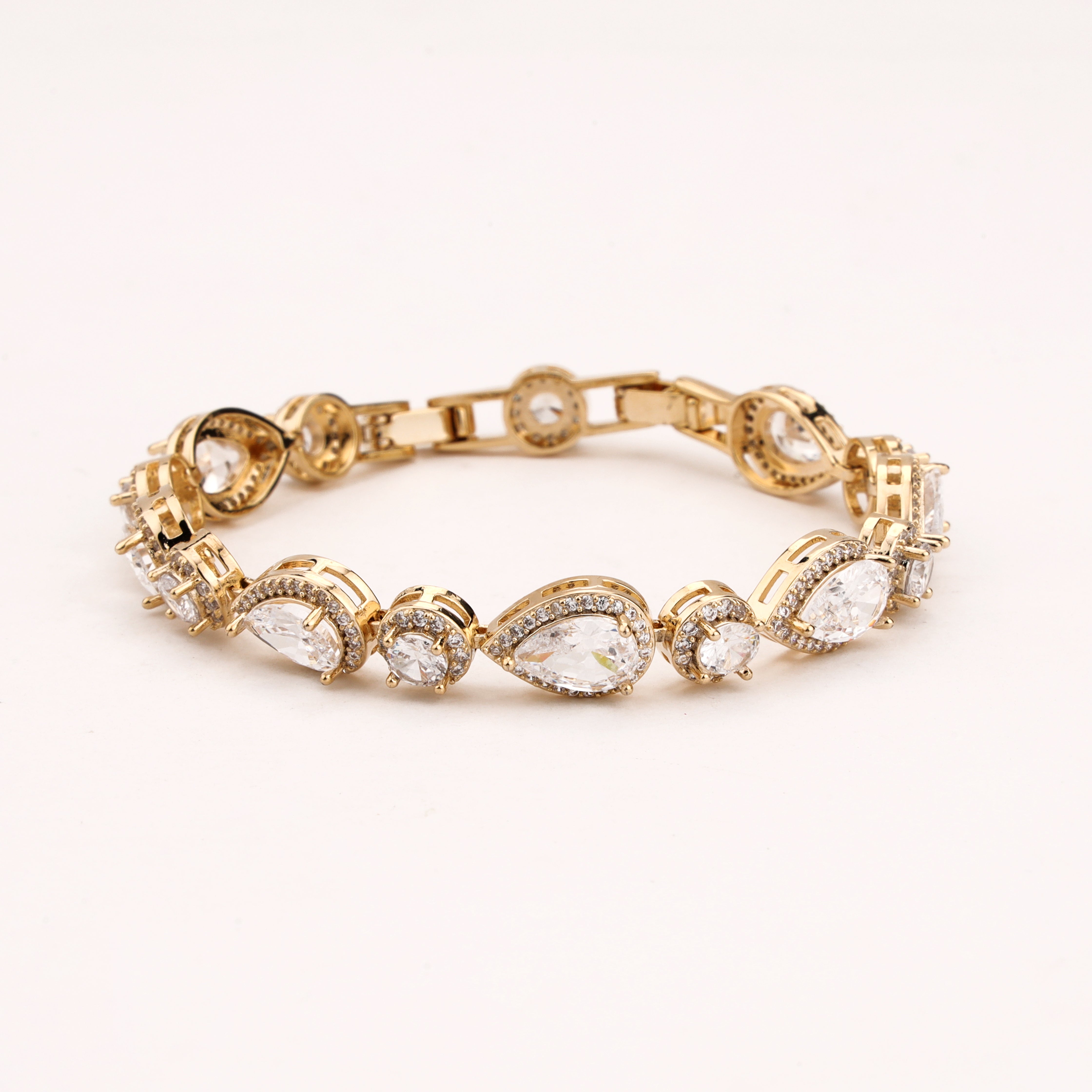 Elaria gold-tone bracelet with pear-shaped and round clear crystals accented by sparkling halo detailing