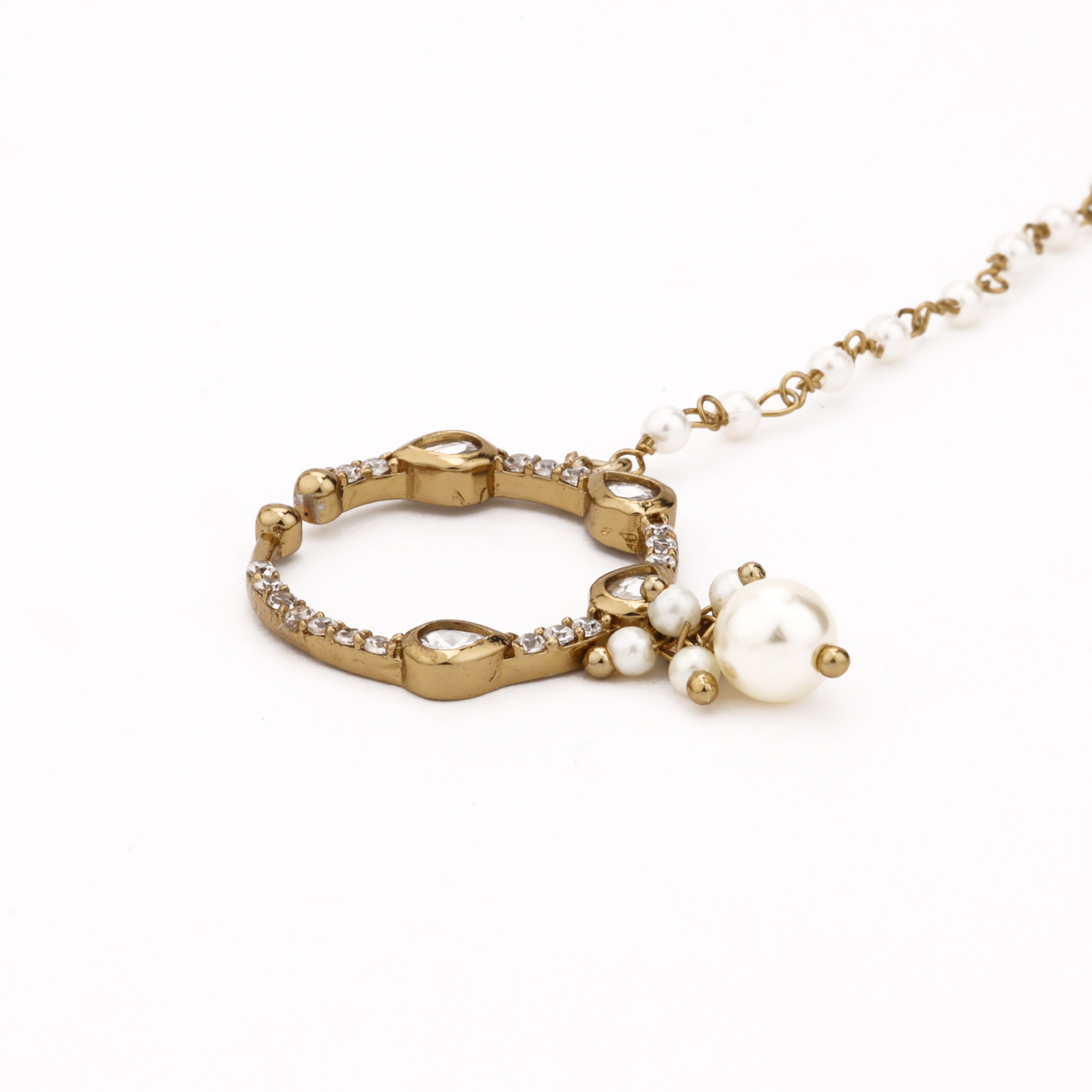 Antique gold Tavisha teardrop polki pearl nath with four white stones, pearl drop and attached beaded chain from US Catalog