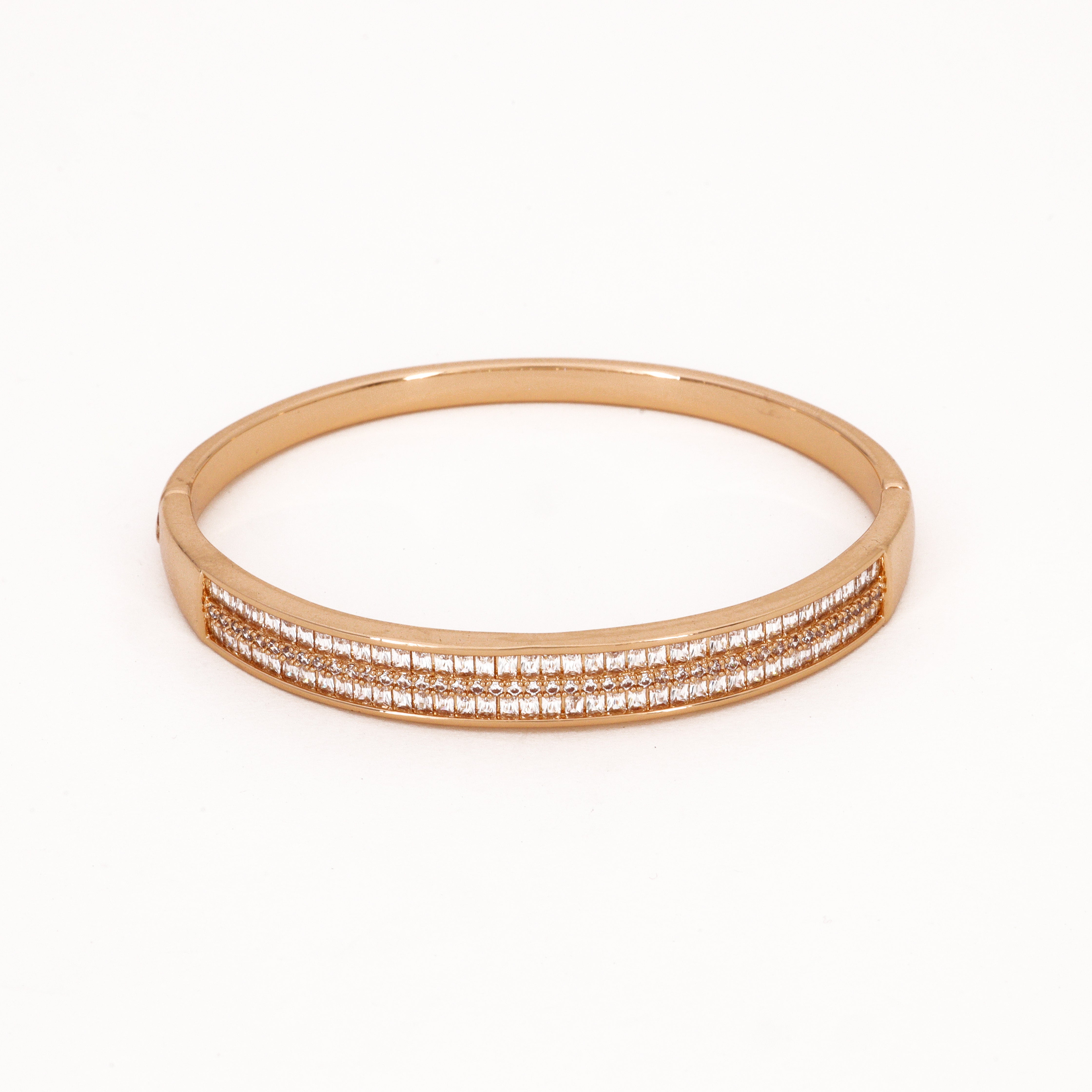 Gold Double Row Baguette Crystal Bangle Bracelet featuring dual rows of clear baguette crystals and a polished hinge finish on a white background