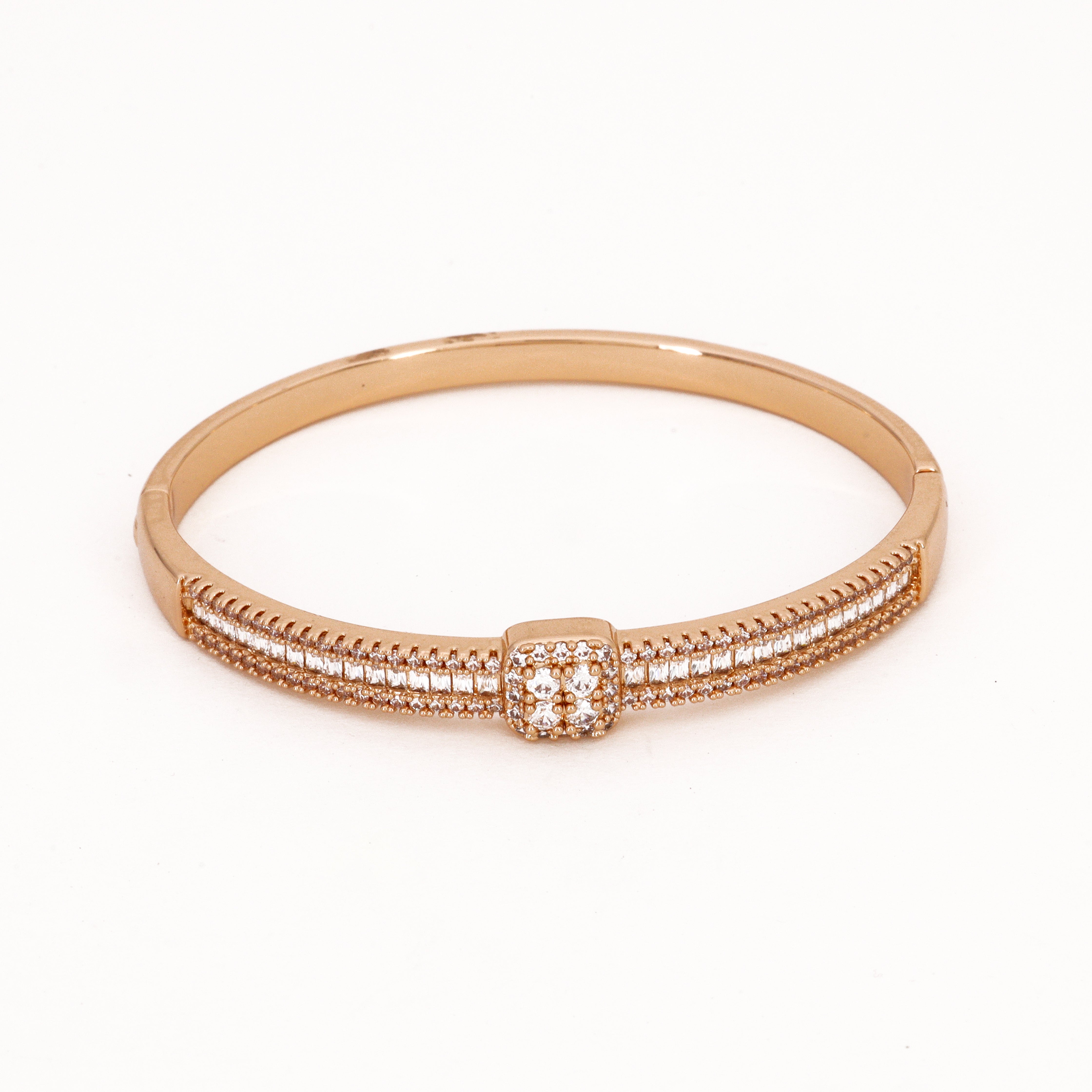 Gold Tone Baguette Crystal & Square Cluster Bracelet featuring a triple-row crystal band and a square four-stone center motif on a white background for US Catalog