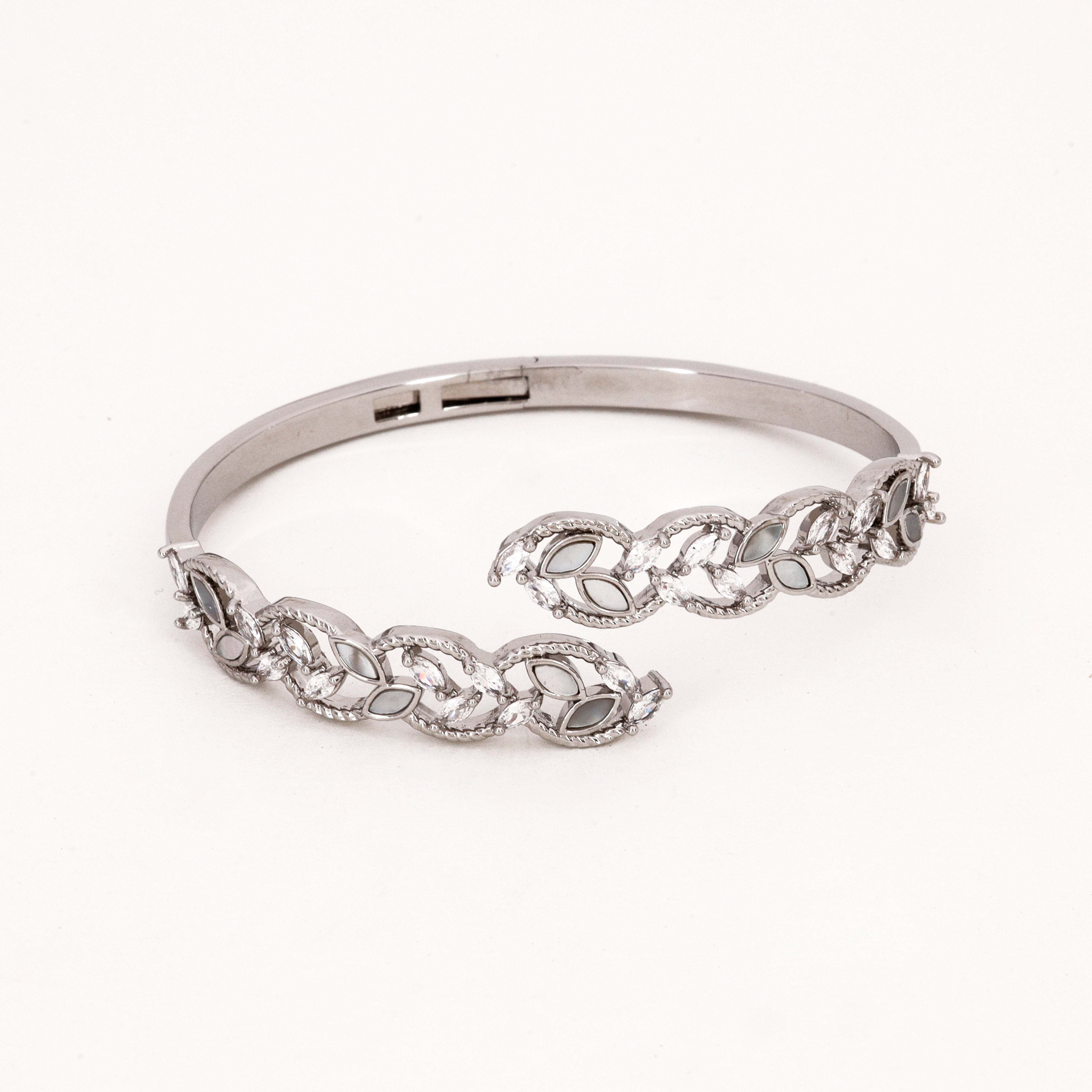 Silver Tone Crystal & Mother of Pearl Vine Bypass Bracelet featuring a botanical leaf design with marquise stones on a white background for US Catalog.