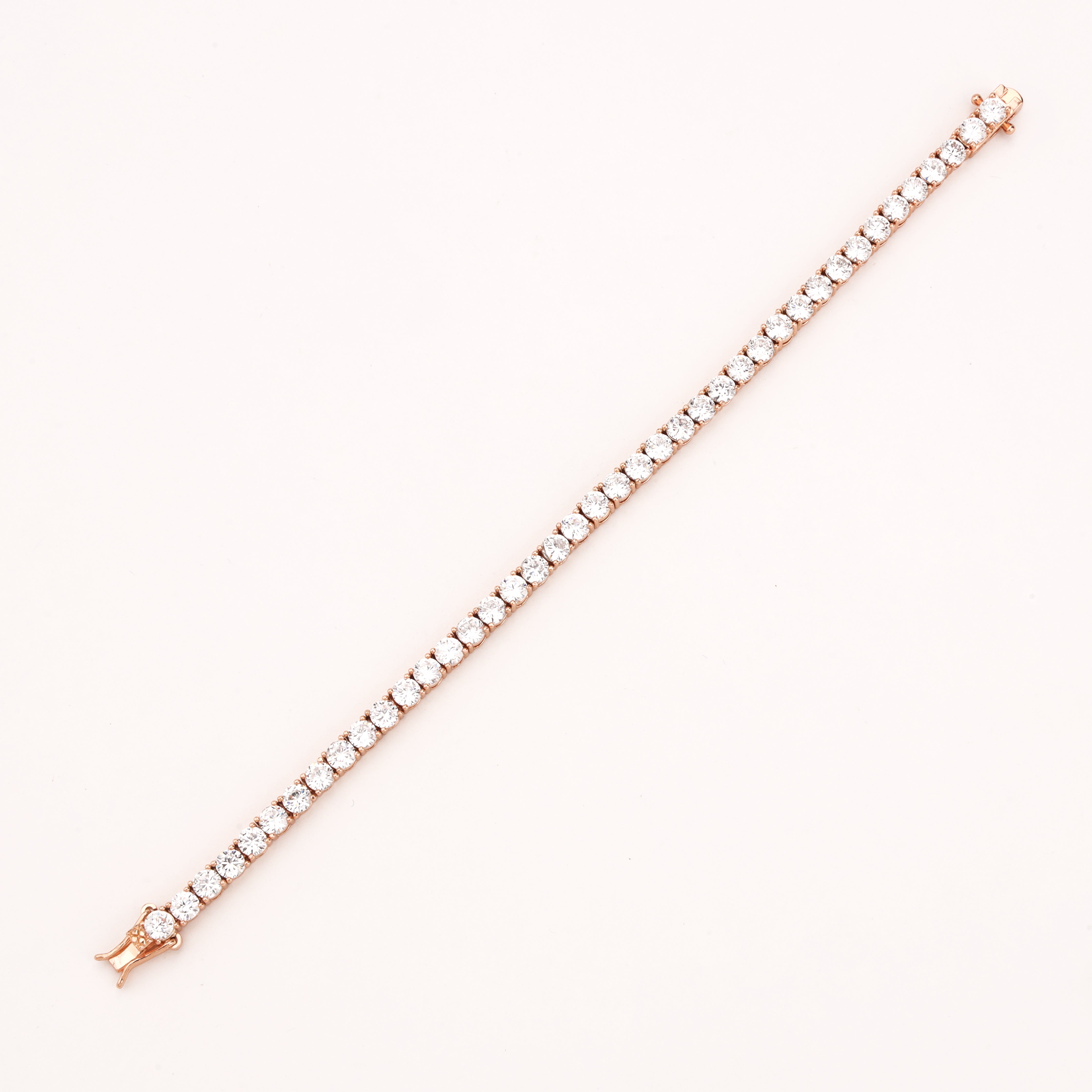 Celestine rose-gold-tone tennis bracelet with a continuous row of round clear crystal stones