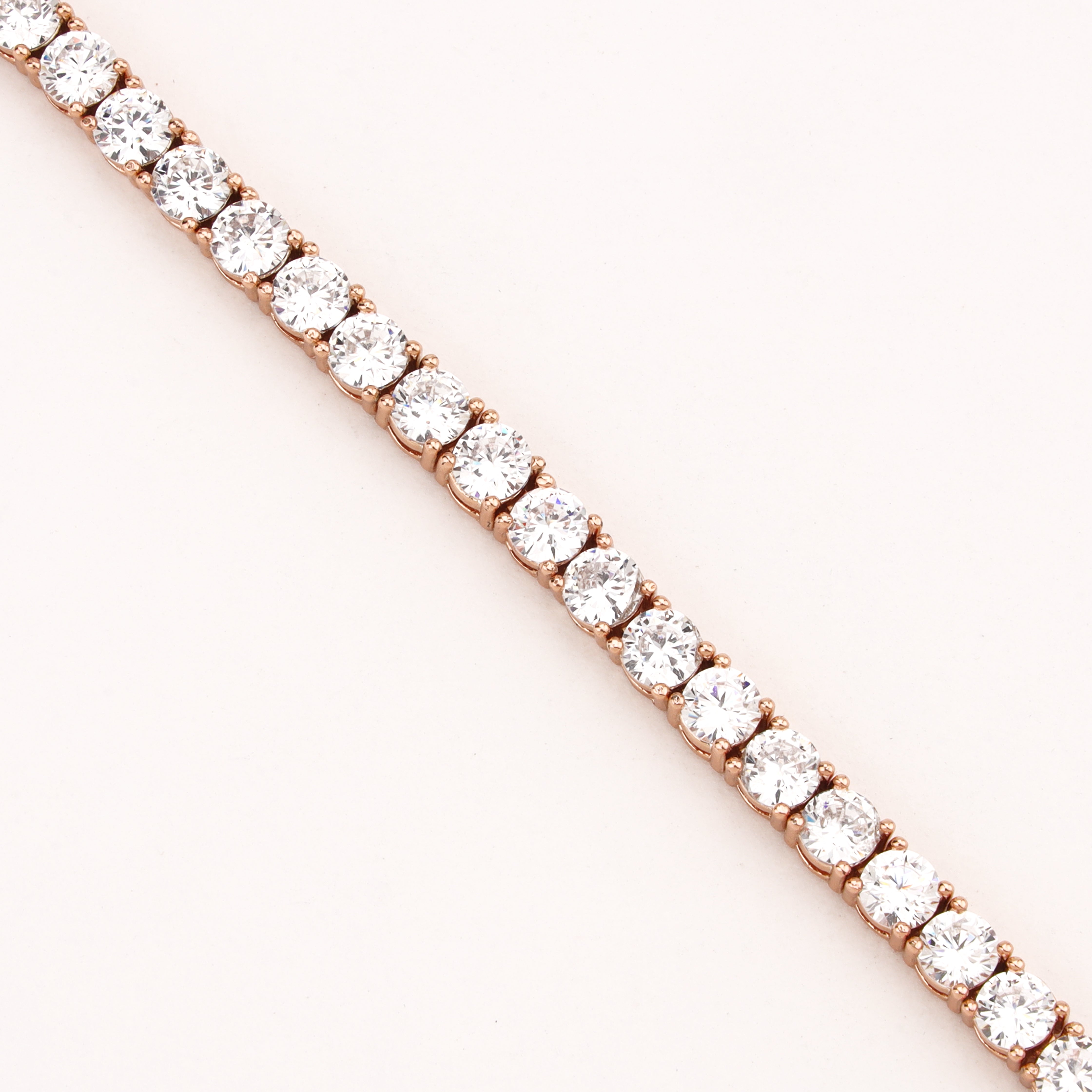 Celestine rose-gold-tone tennis bracelet with a continuous row of round clear crystal stones