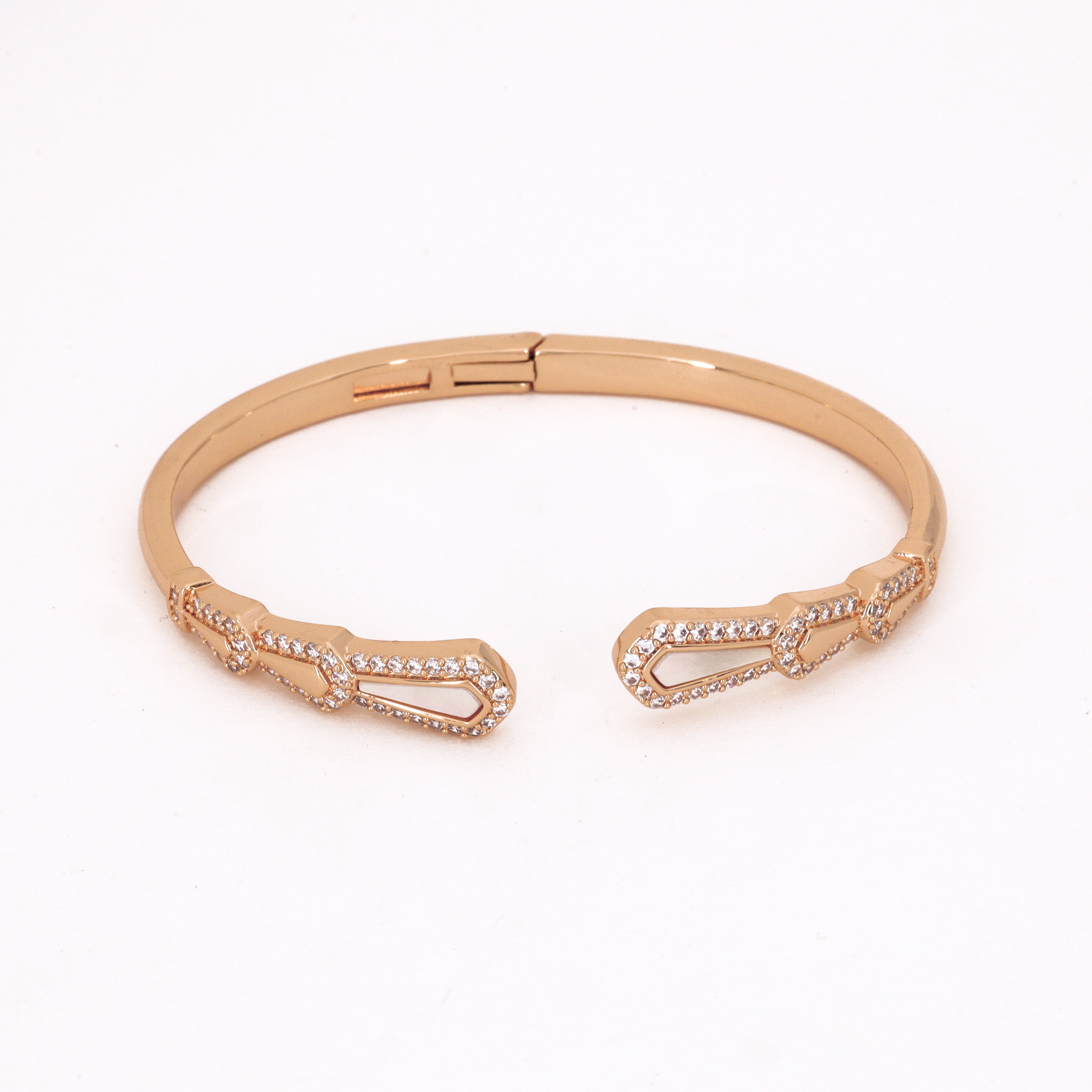 Gold Tone Crystal Geometric Cut-Out Open Bracelet featuring an open-front design with pavé crystal shield motifs on a white background for US Catalog.