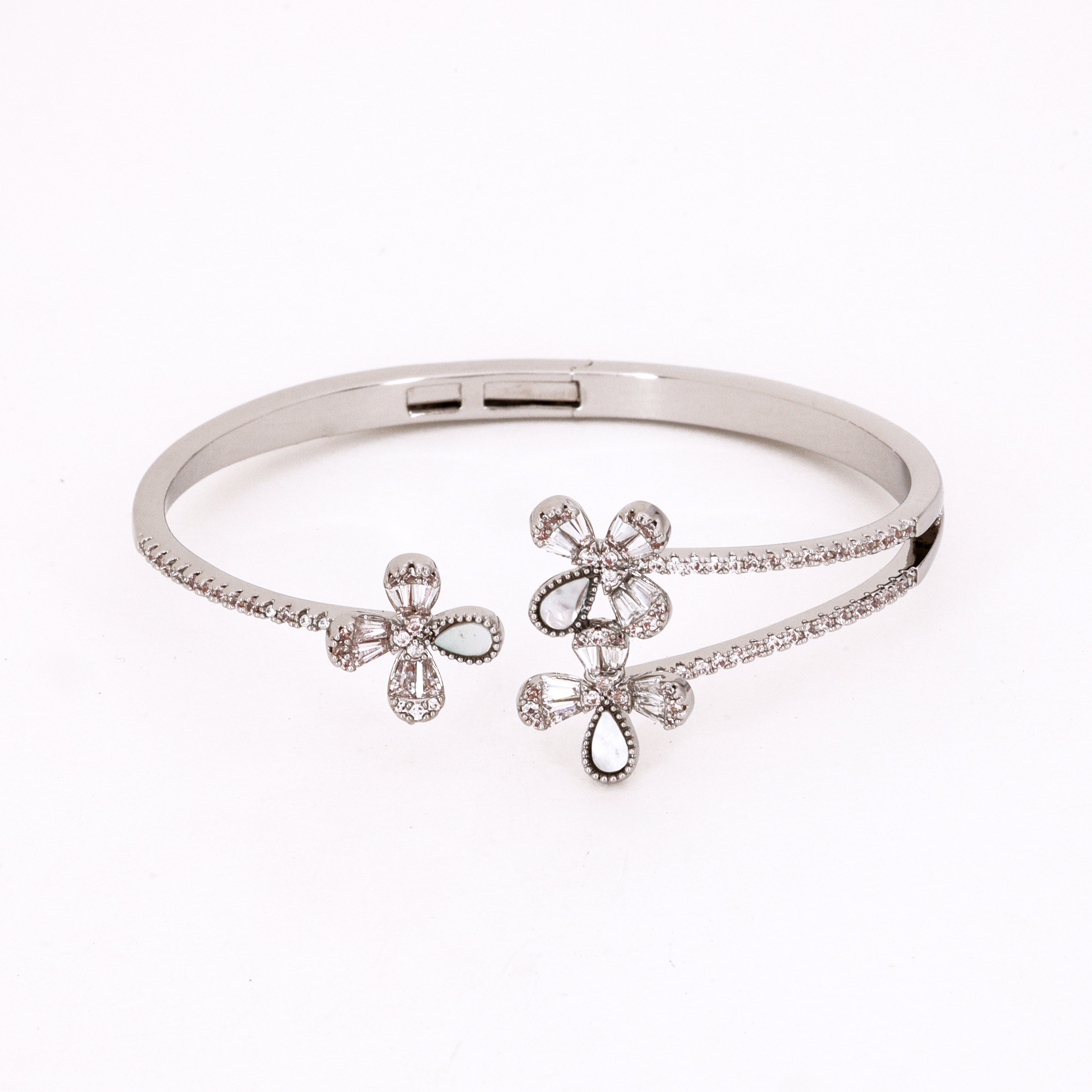 Floral Crystal Bypass Bracelet featuring a romantic overlapping design with three delicate crystal flower motifs on a white background