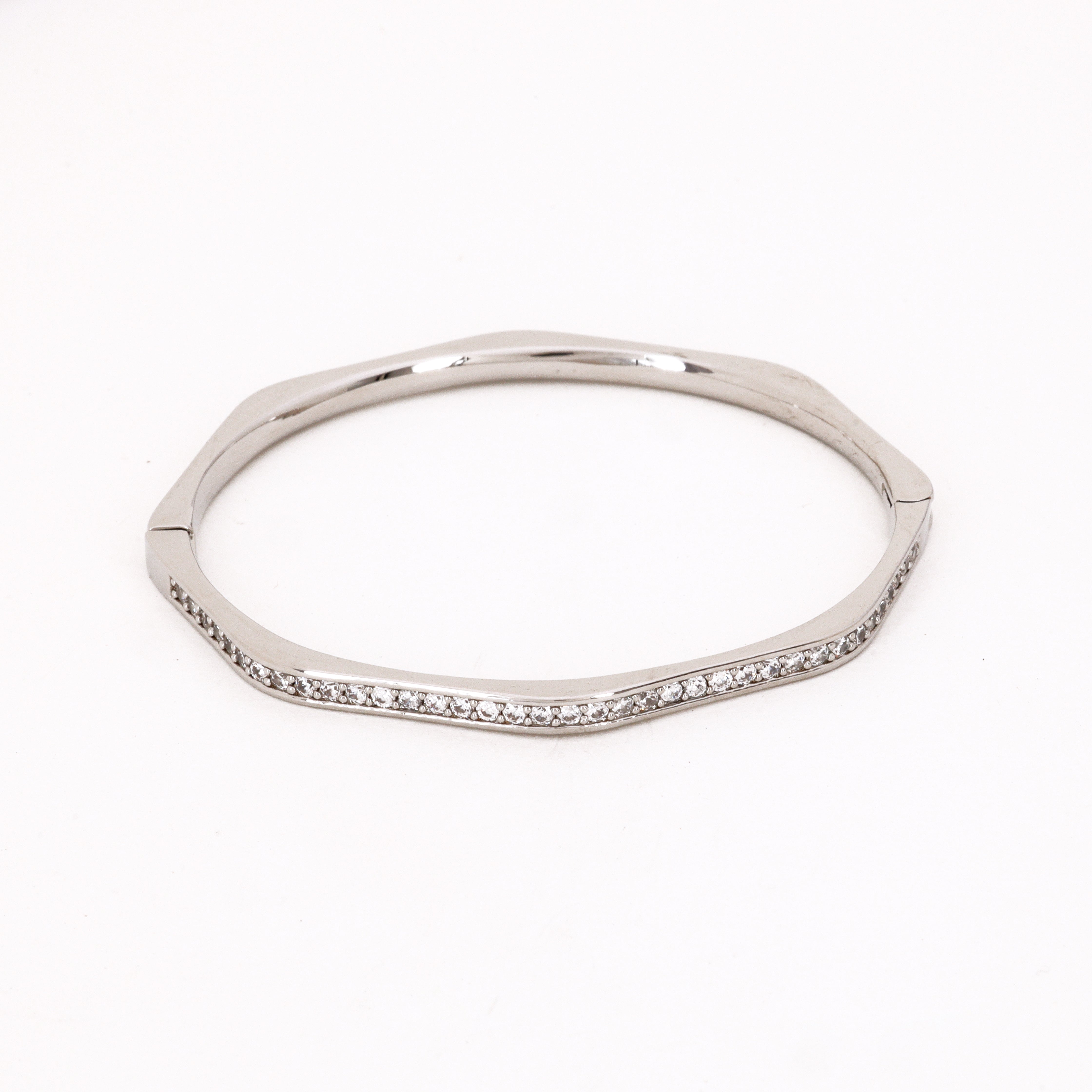 Rose Gold Rippled Crystal Bangle Bracelet featuring a unique wavy silhouette and clear crystal edge accents on a white background for US Catalog.
