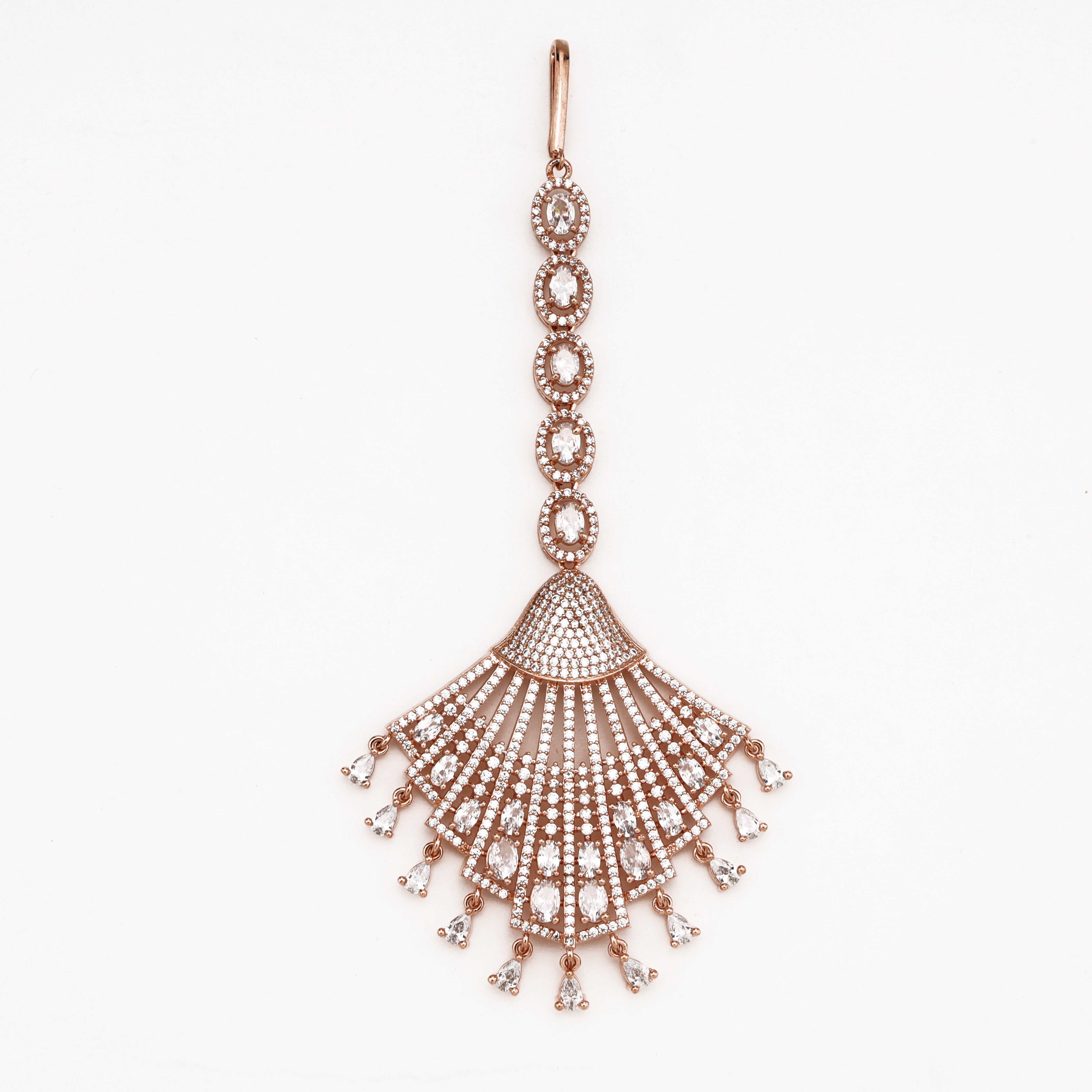 Rose gold plated American diamond maang tikka featuring oval halo chain links, flared fan pendant, and dangling white pear crystals.