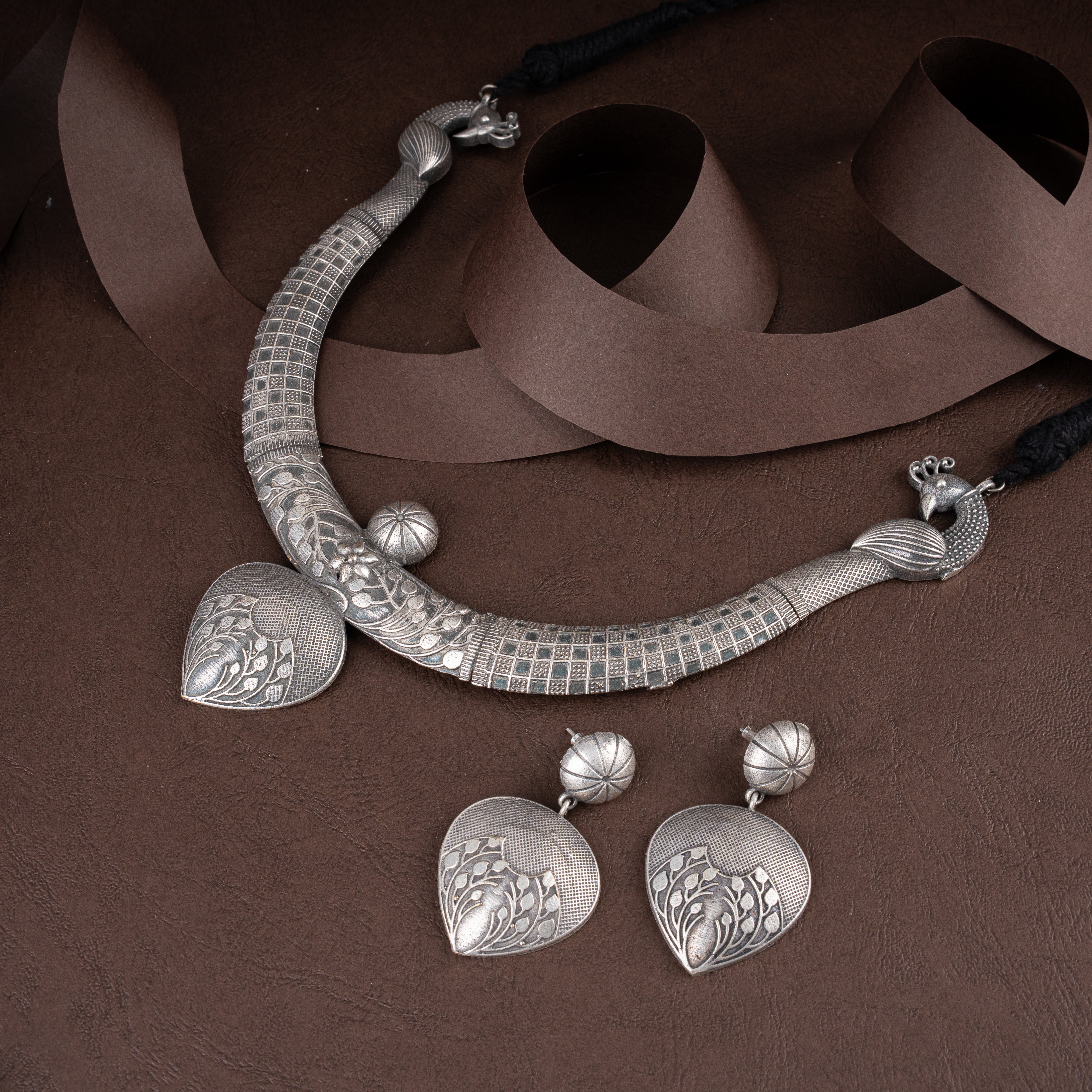 Artisanal Peacock Terminal Engraved Hasli Necklace Set with Leaf Drop Earrings