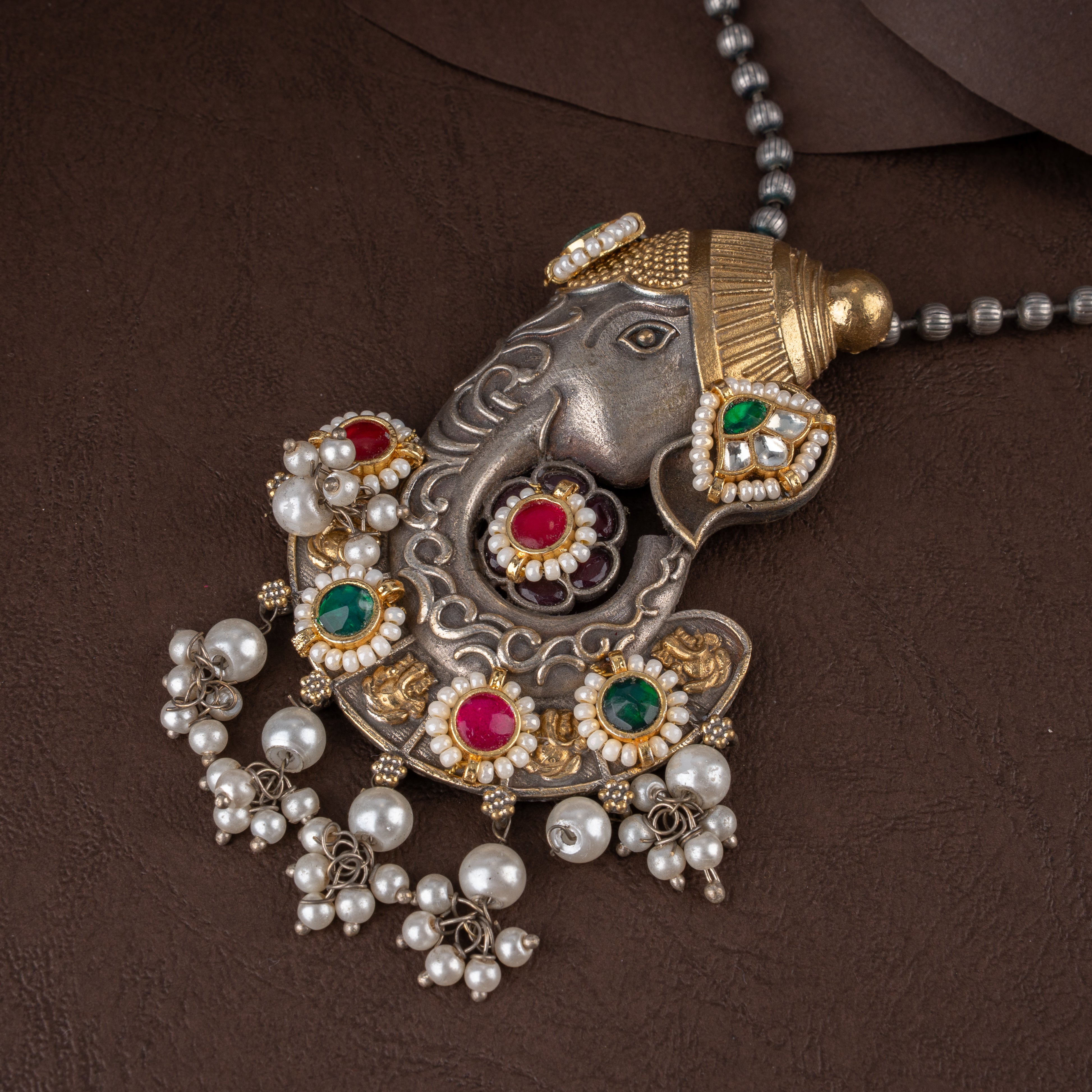 Dual-Tone Lord Ganesha Pendant Necklace Set with Kundan Stones and Pearl Drops