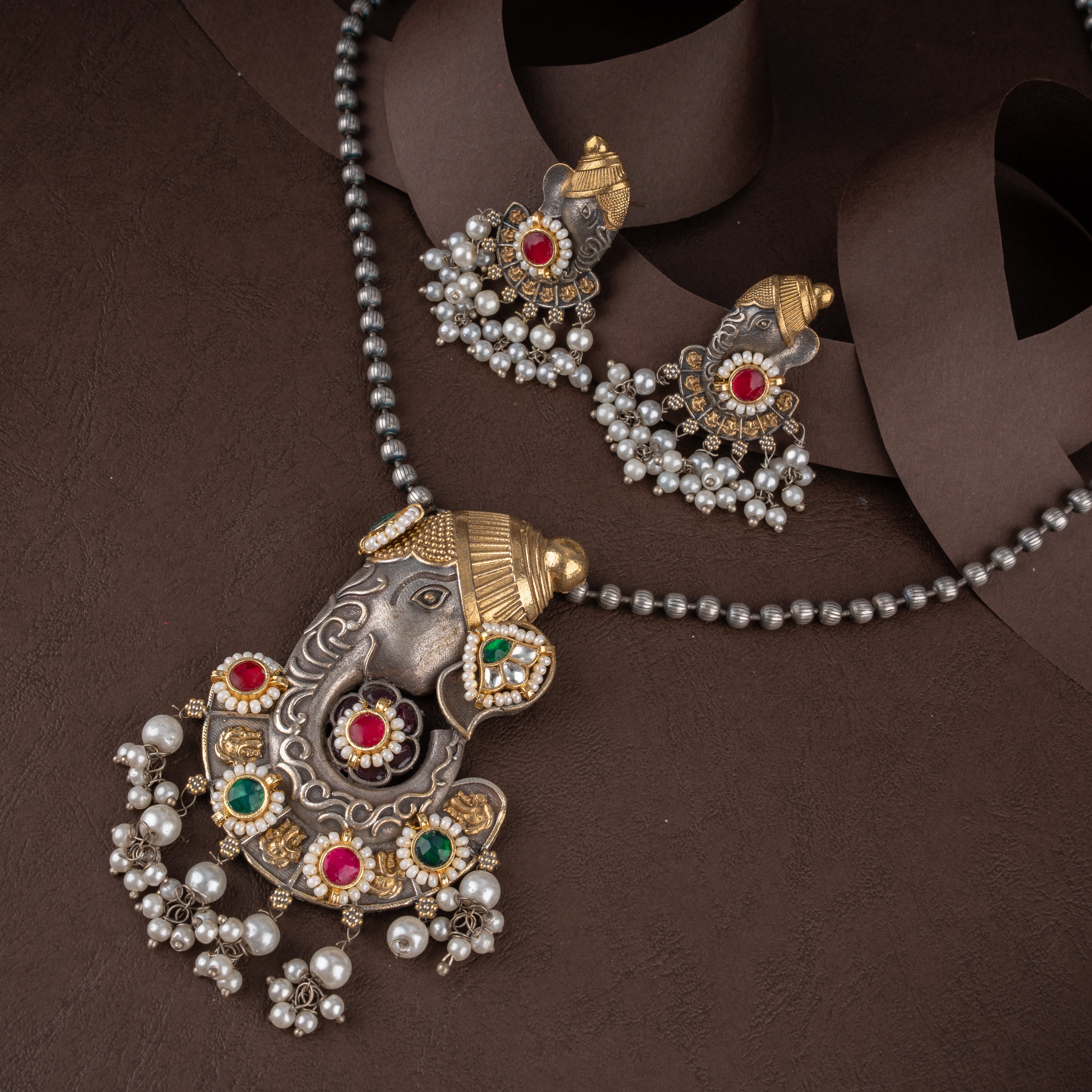 Dual-Tone Lord Ganesha Pendant Necklace Set with Kundan Stones and Pearl Drops