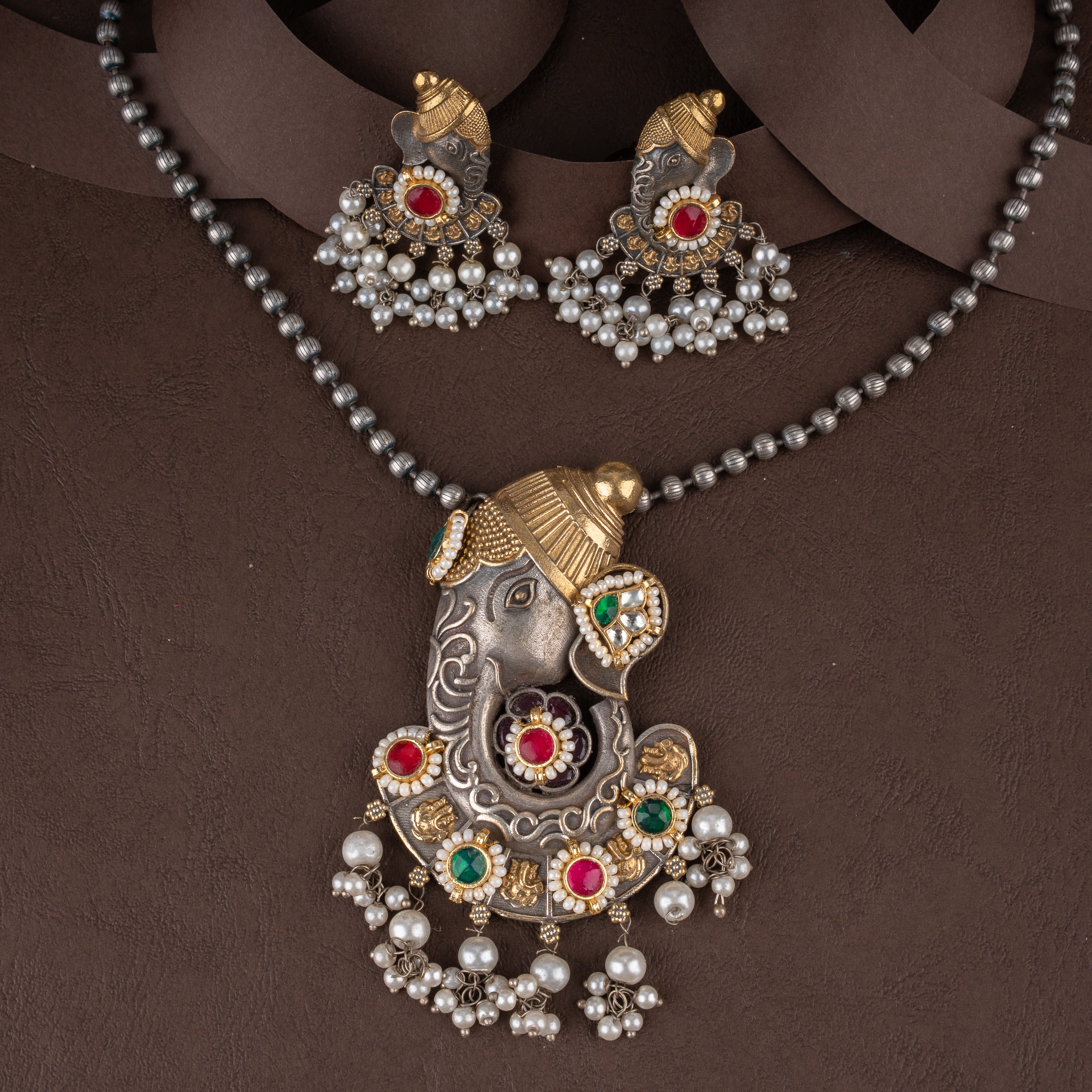 Dual-Tone Lord Ganesha Pendant Necklace Set with Kundan Stones and Pearl Drops