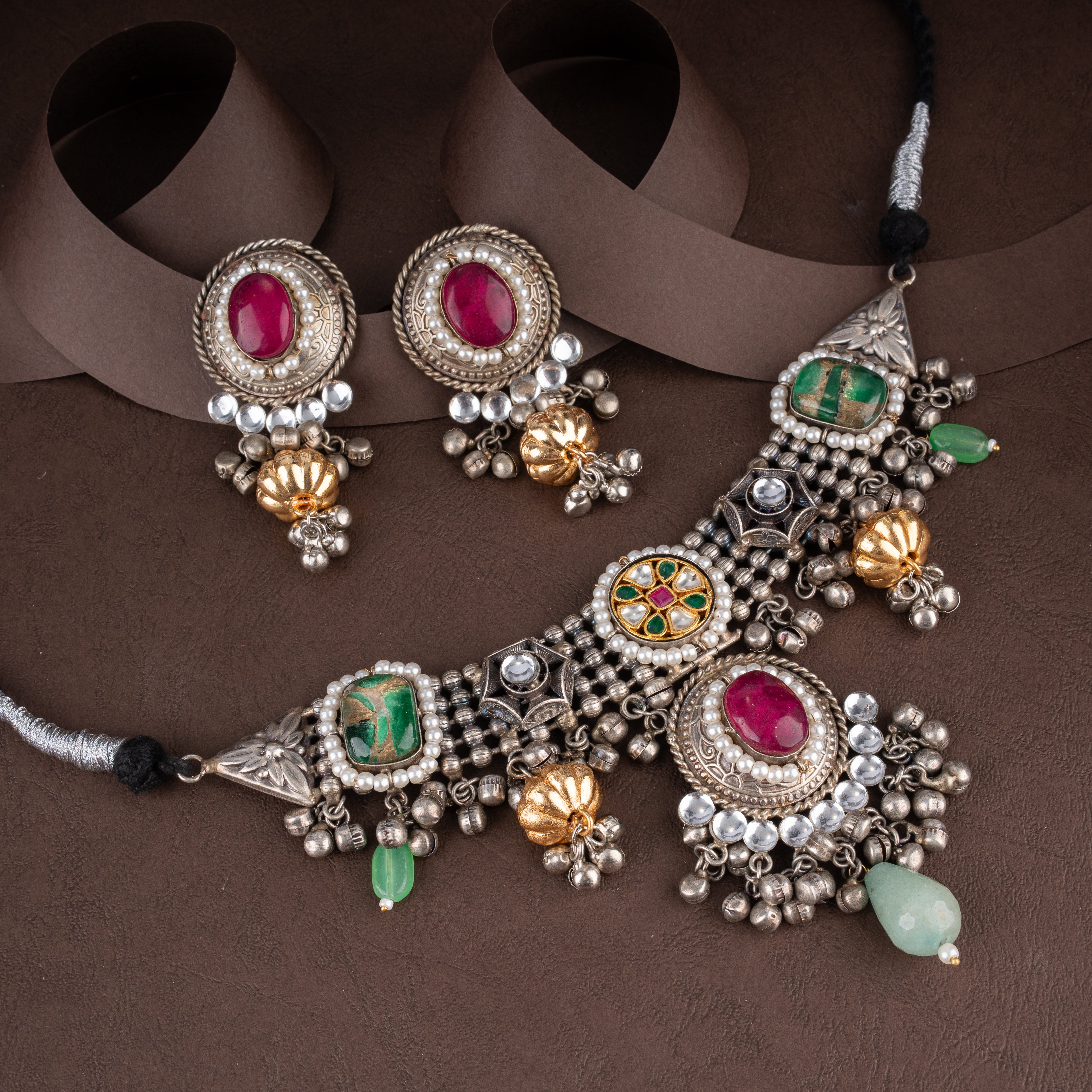 Oxidised Kundan Navratna-Inspired Choker Necklace Set with Cabochon Stones, Ghungroos, and Drop Earrings