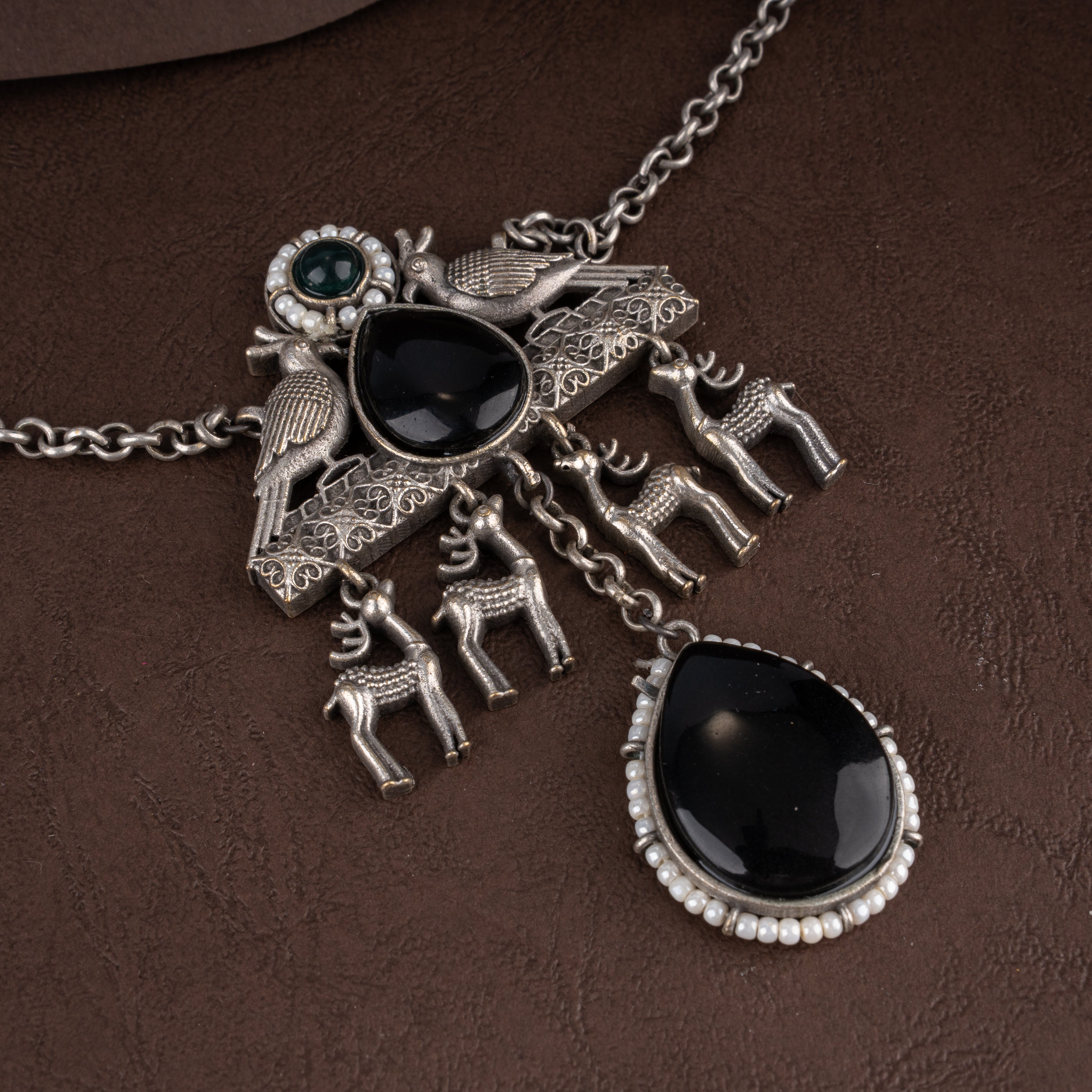 Oxidised Tribal Deer and Bird Medallion Pendant Necklace Set with Black Teardrop Stones and Seed Pearl Halos