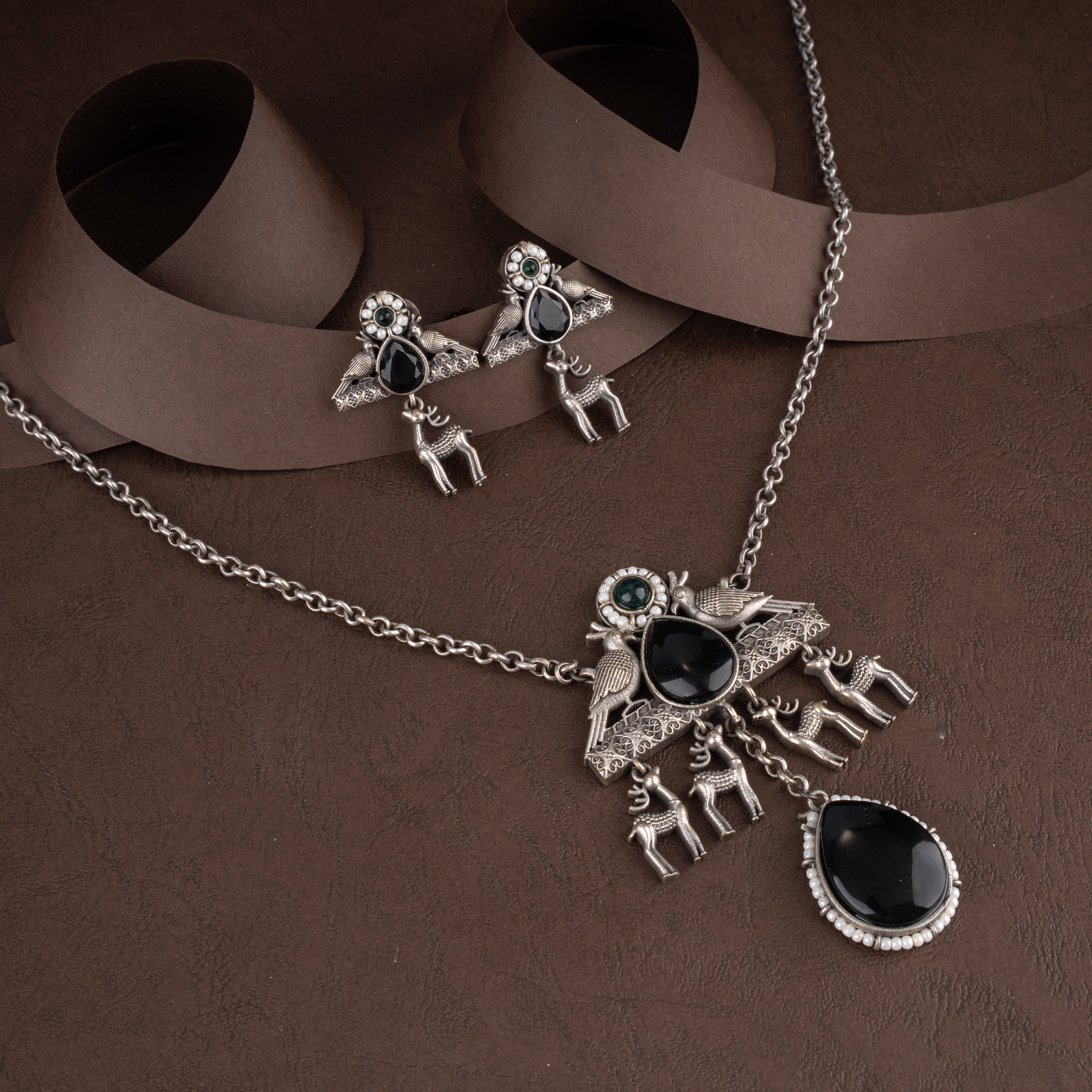 Oxidised Tribal Deer and Bird Medallion Pendant Necklace Set with Black Teardrop Stones and Seed Pearl Halos