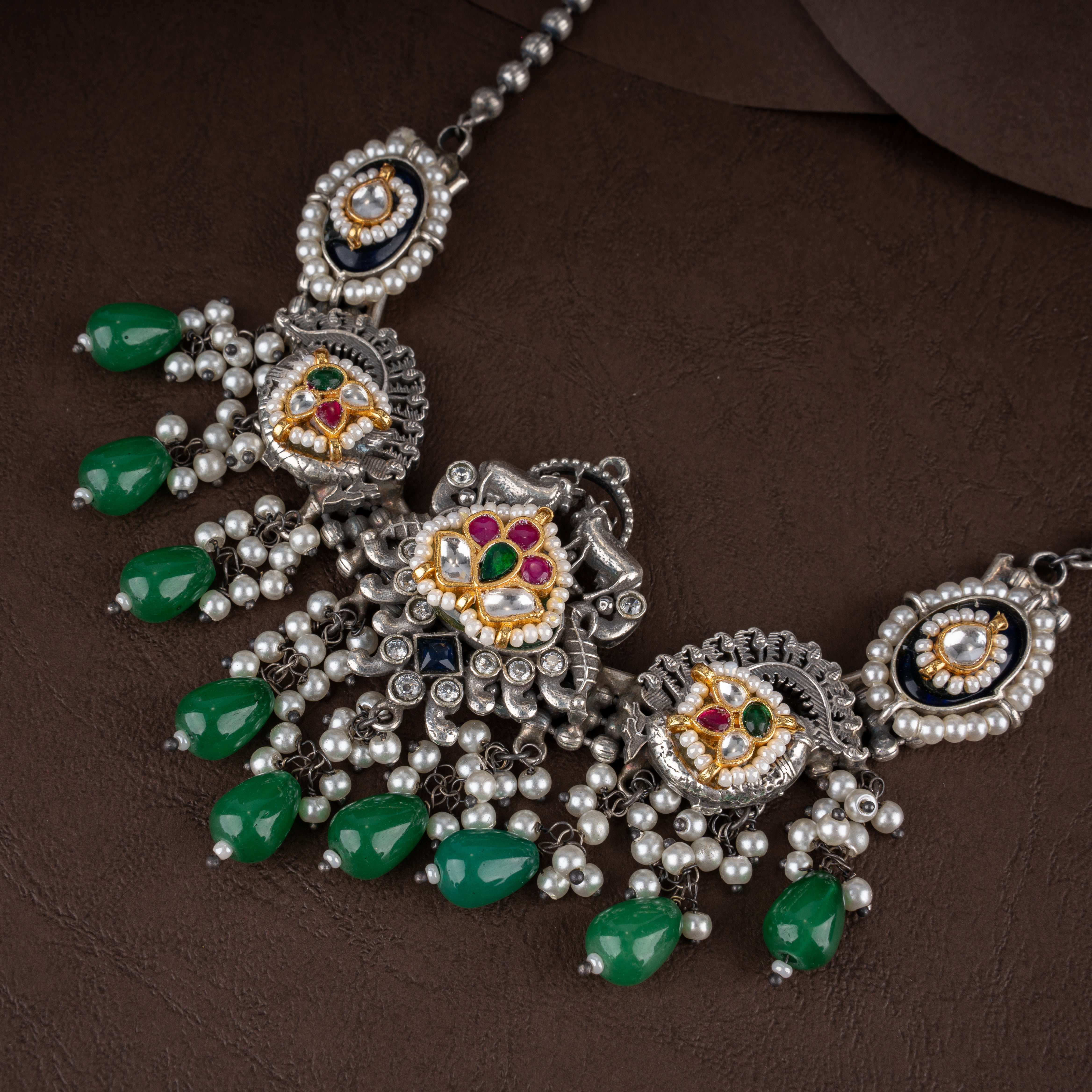 Dual-Tone Kundan Peacock Medallion Bib Necklace Set with Emerald Green Drops and Pearl Clusters