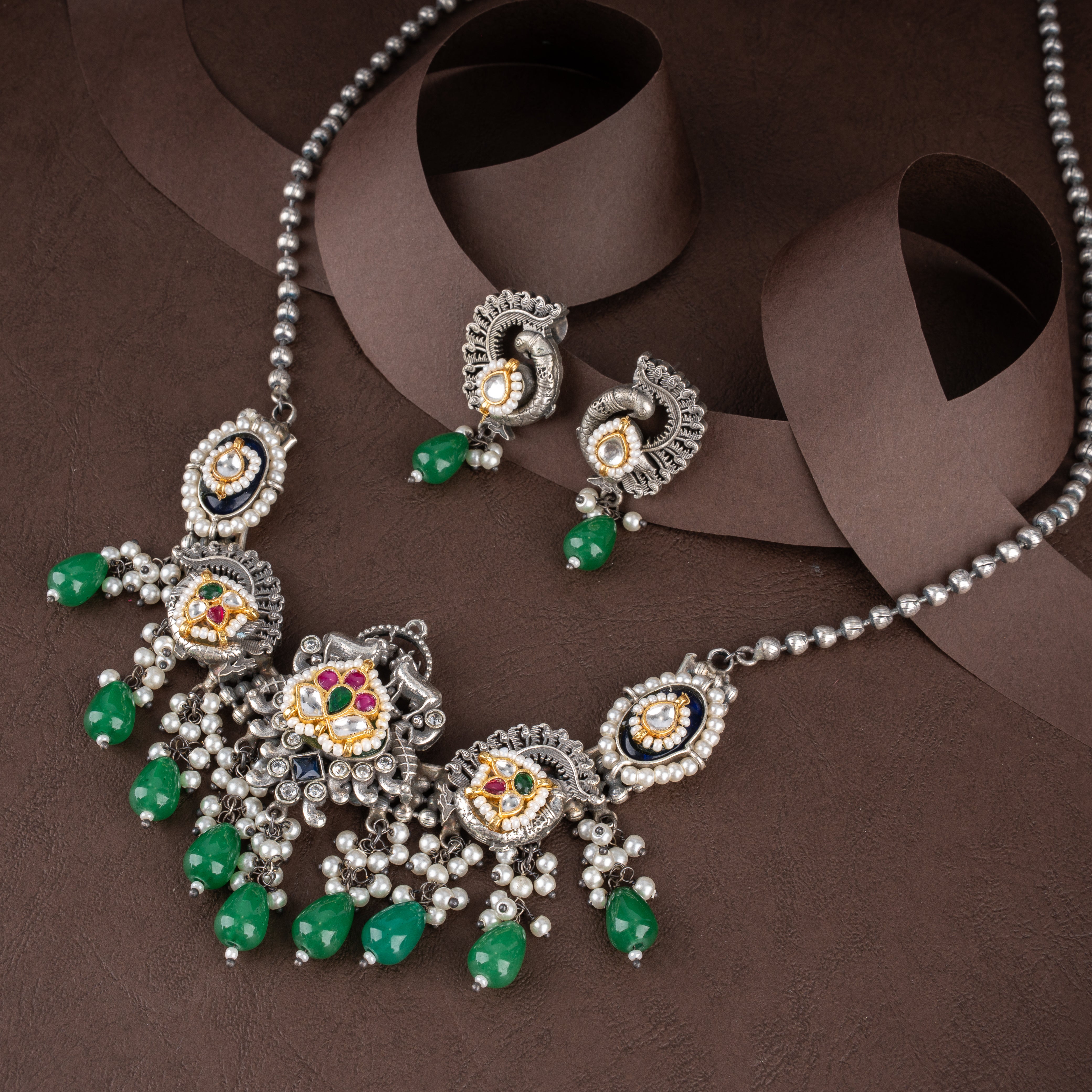 Dual-Tone Kundan Peacock Medallion Bib Necklace Set with Emerald Green Drops and Pearl Clusters