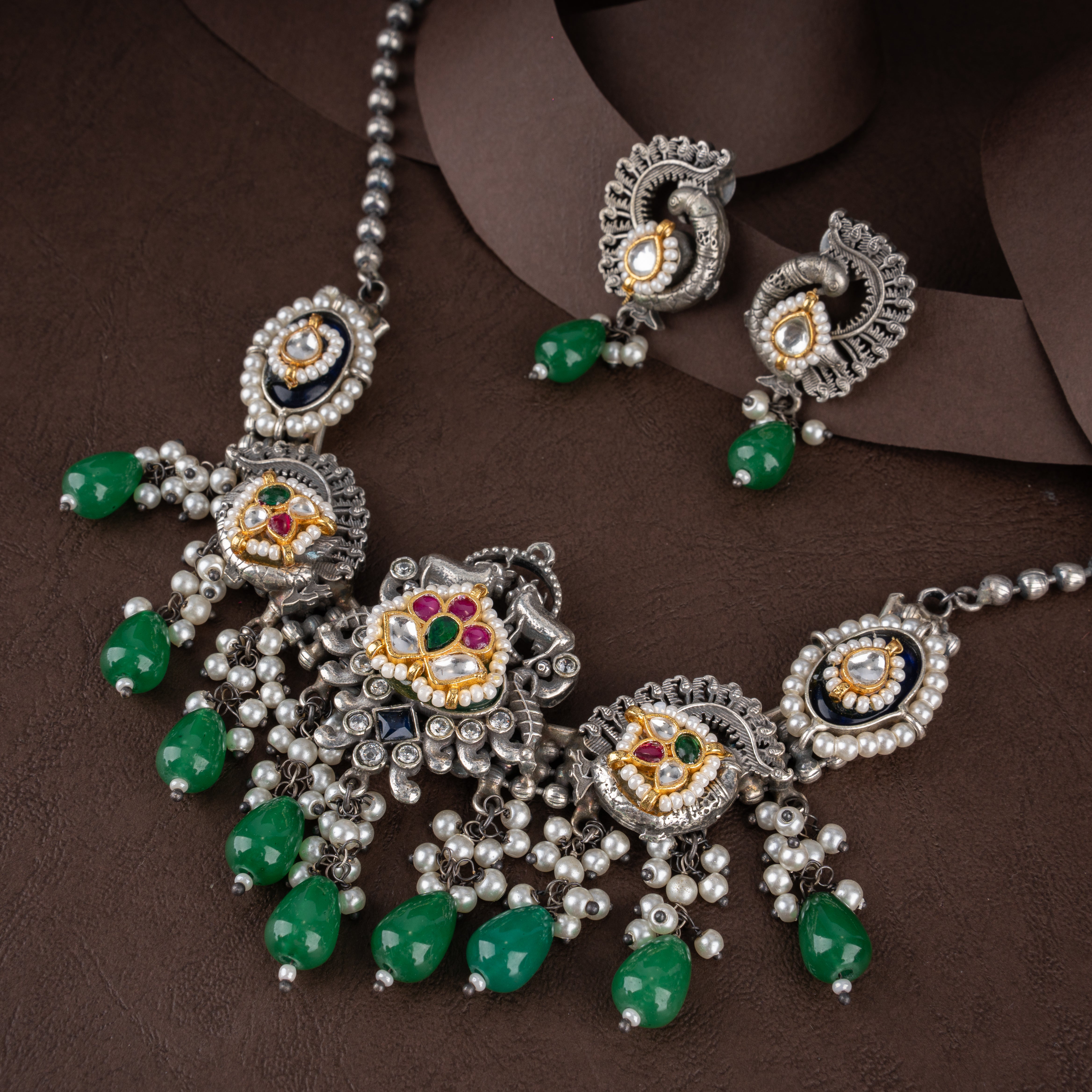 Dual-Tone Kundan Peacock Medallion Bib Necklace Set with Emerald Green Drops and Pearl Clusters