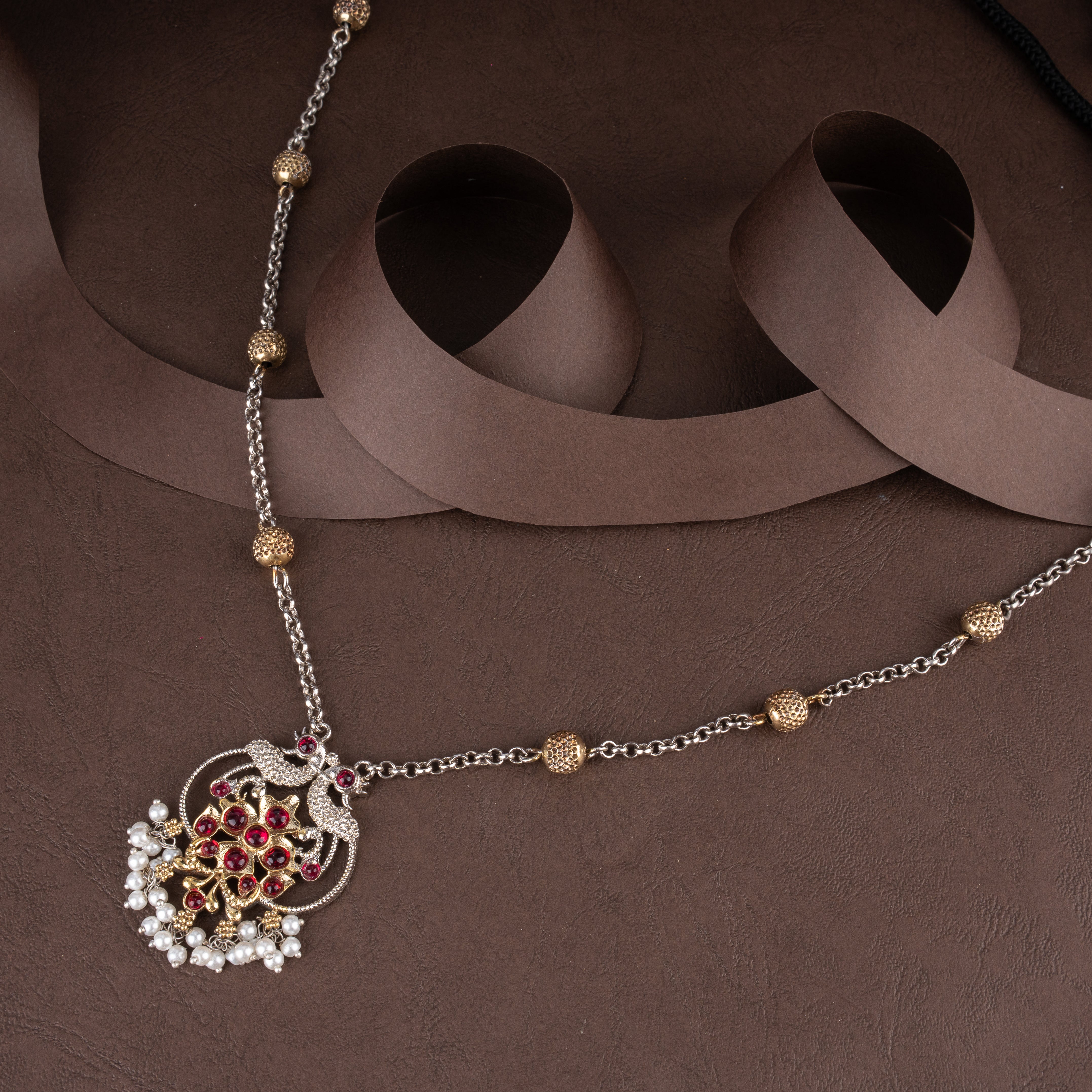 Dual-Tone Ruby-Pink Kundan Peacock Medallion Pendant Necklace Set with Seed Pearl Clusters and Drop Earrings