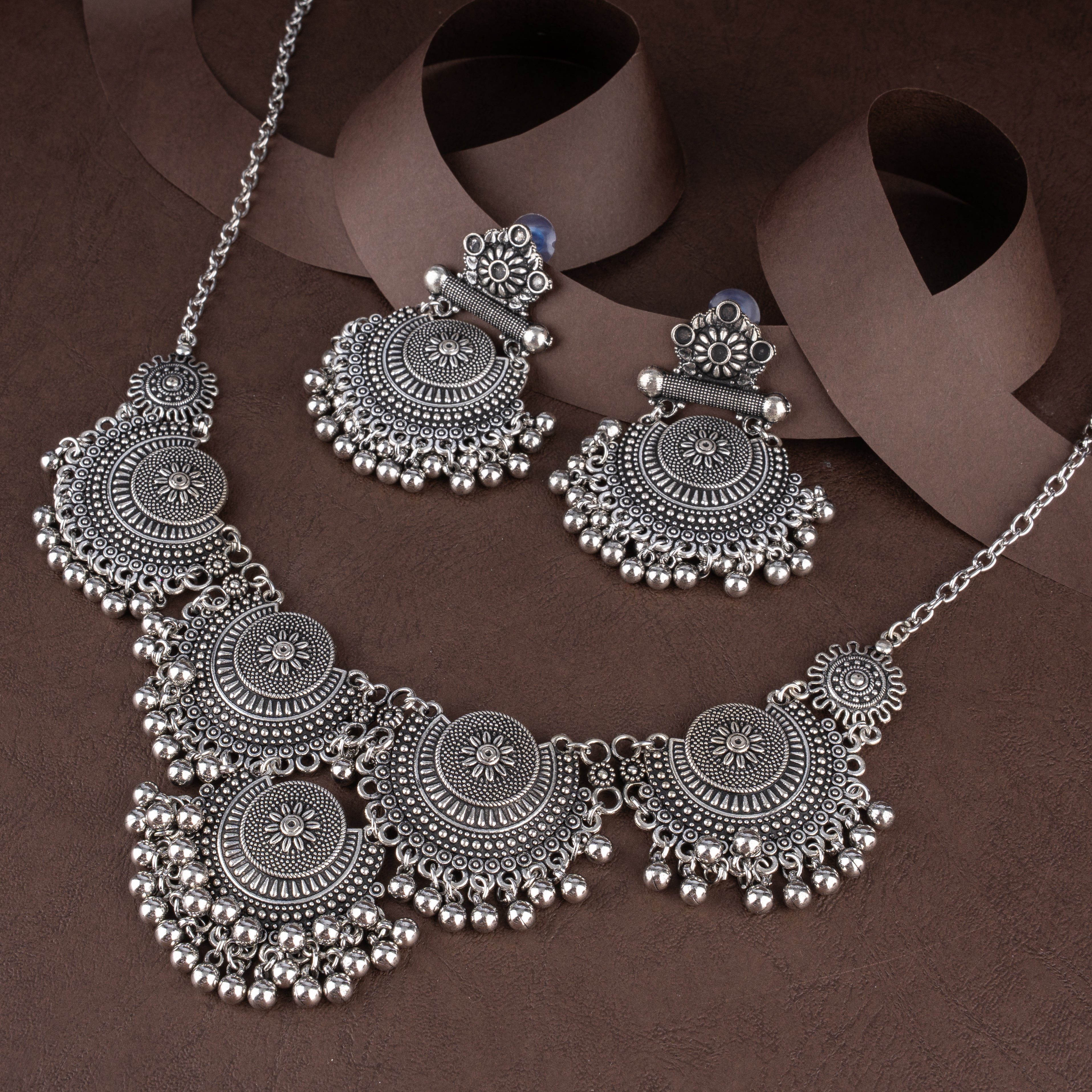 Oxidised Semicircular Sunburst Medallion Bib Necklace Set with Ghungroo Bell Fringe