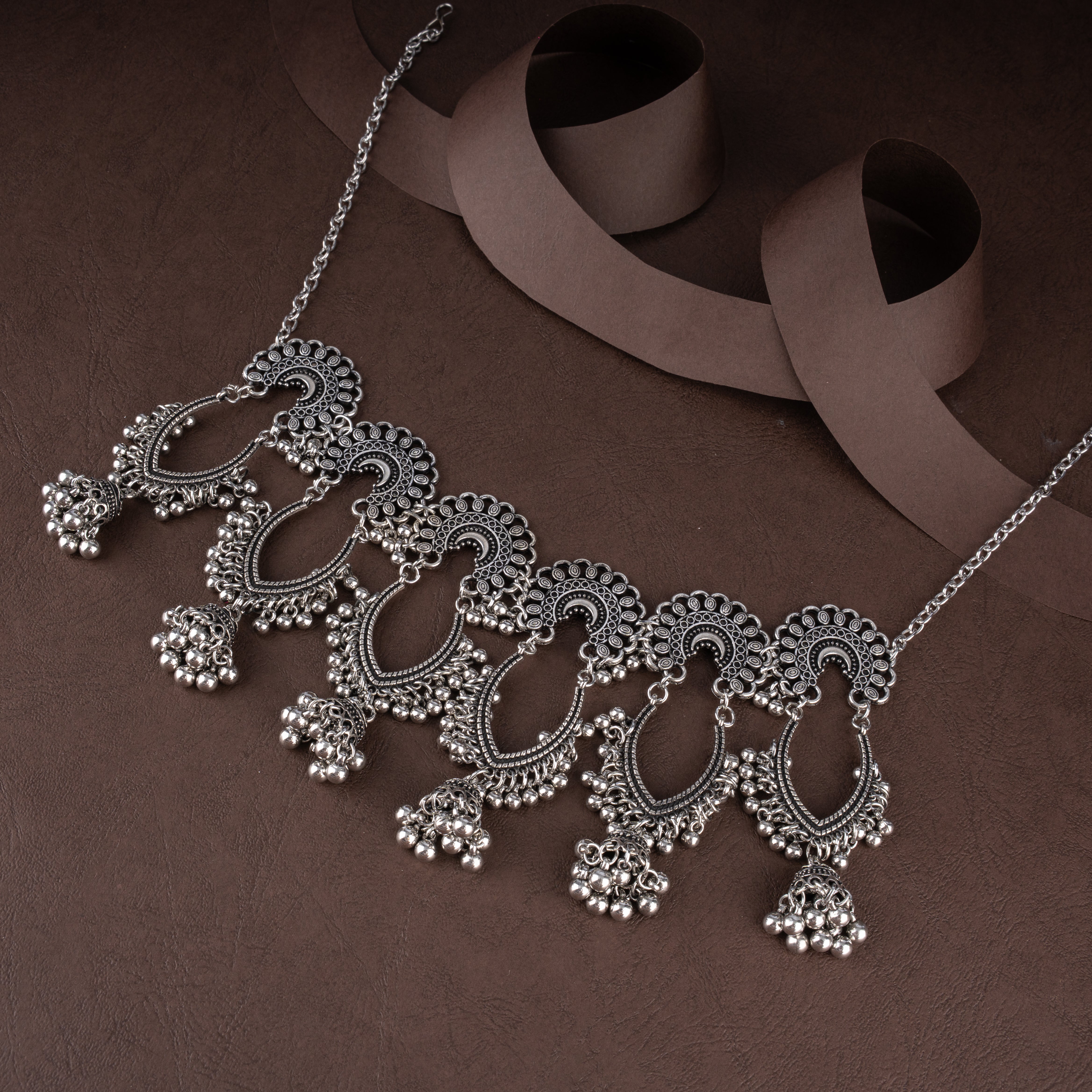 Oxidised Openwork Teardrop Scallop Bib Necklace Set with Dome Jhumkis and Ghungroo Fringe