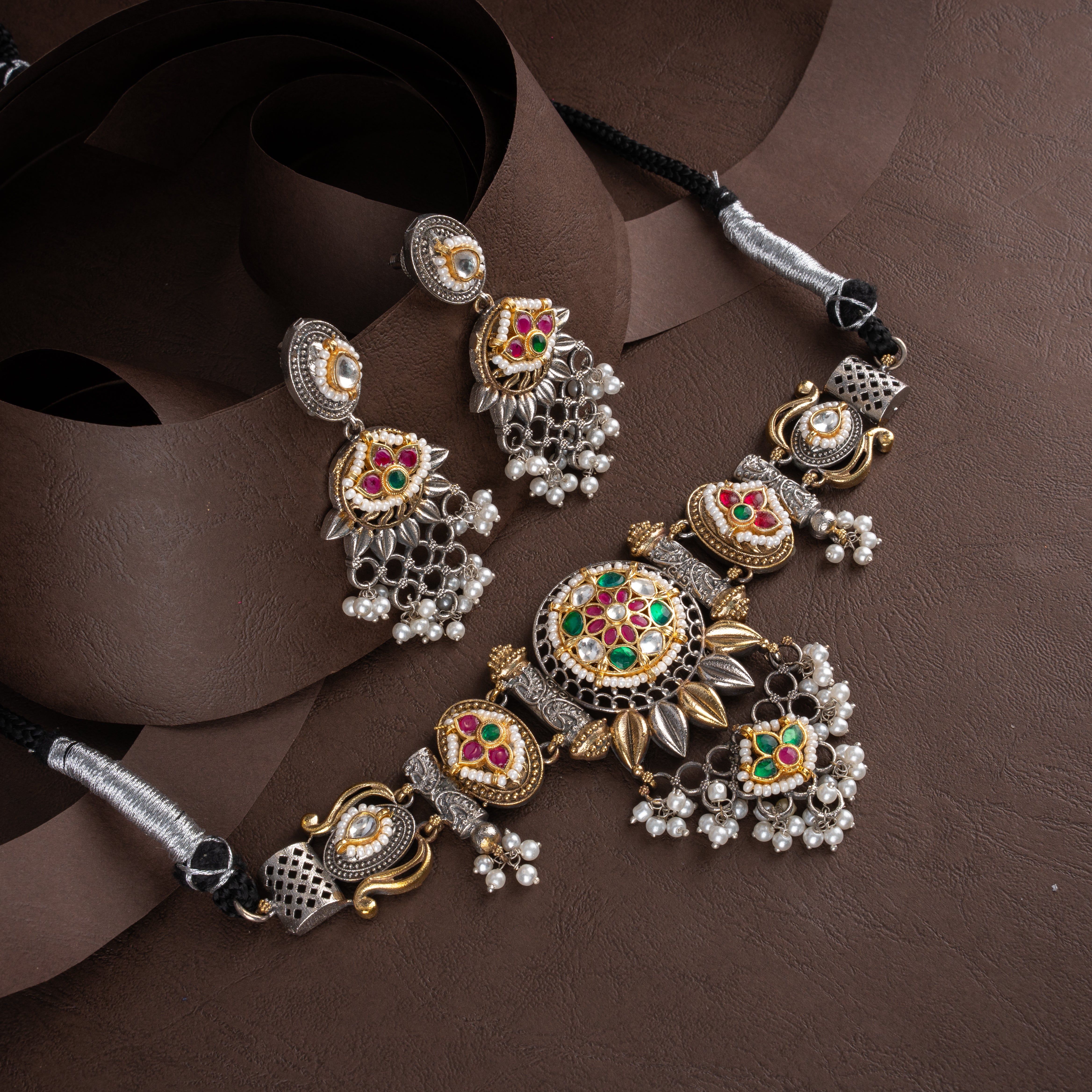 Dual-tone oxidised silver and gold temple choker necklace set featuring a domed floral medallion, pearl bead clusters, and matching drop earrings.